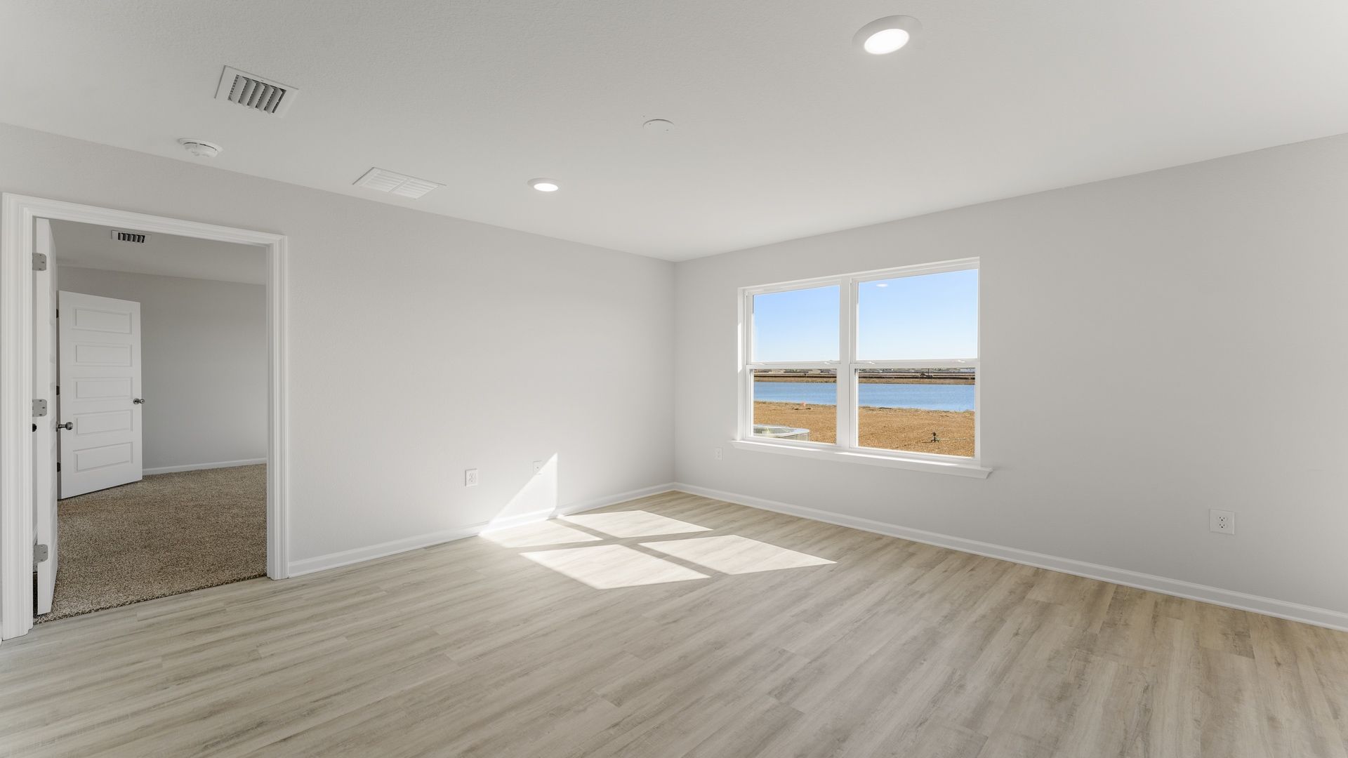 The spacious living area is open to the dining with EVP flooring