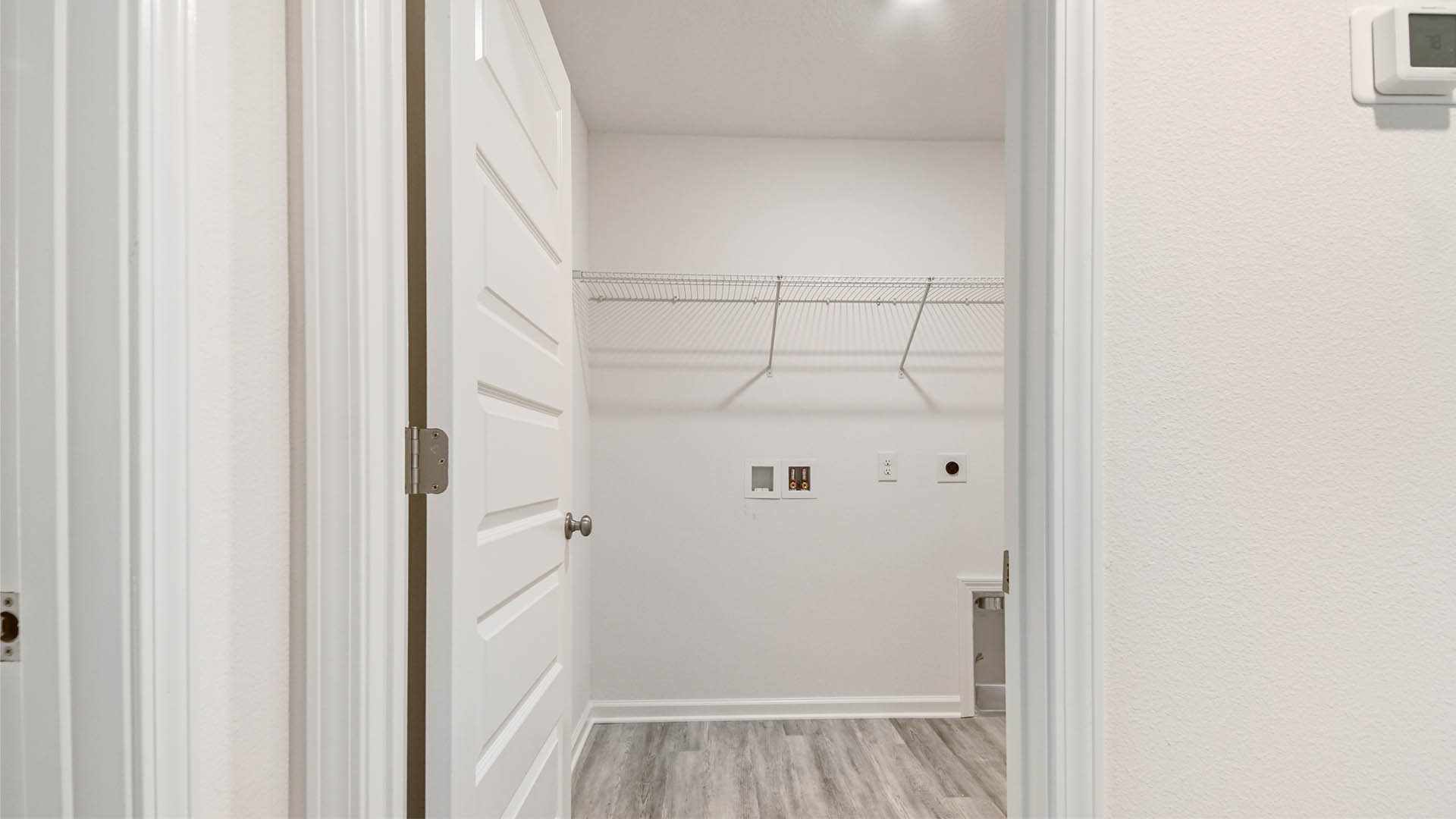 Laundry room located off bedroom four