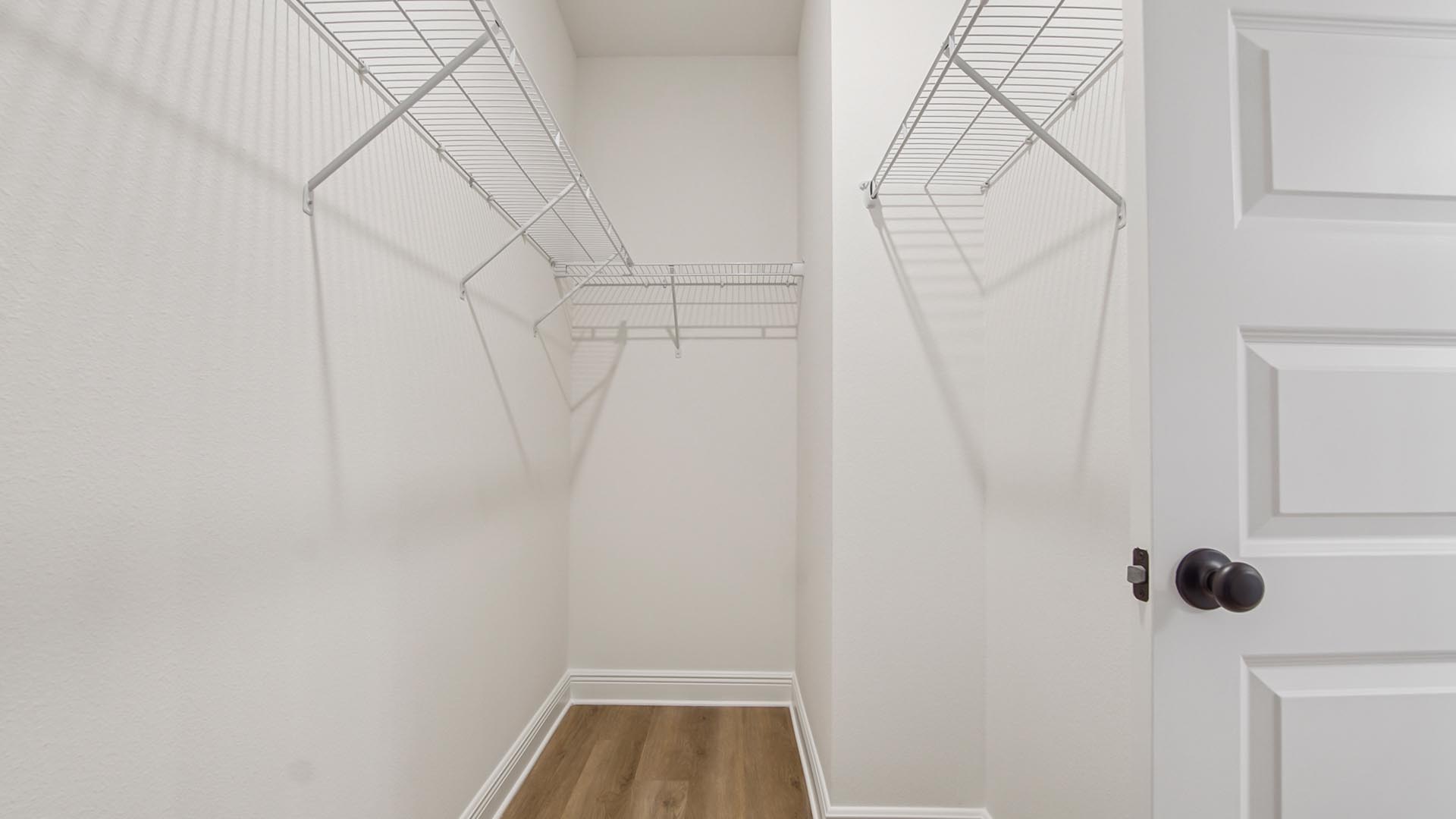 A spacious closet is in the primary bathroom