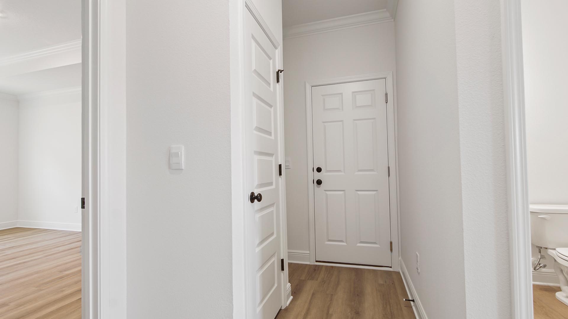 There is an additional hall that holds the laundry room and garage access and the appointed study