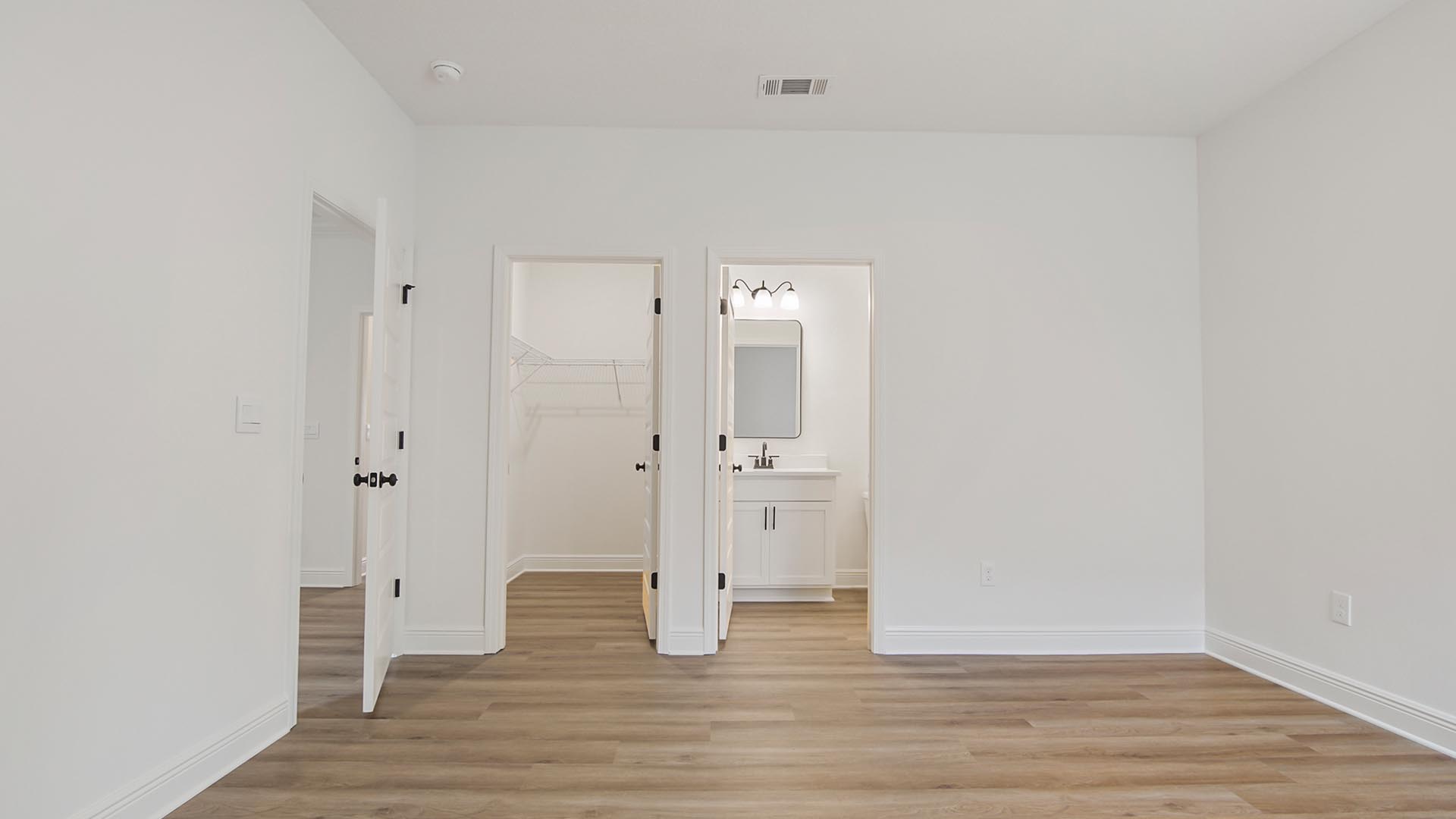The guest bedroom off the study has EVP flooring