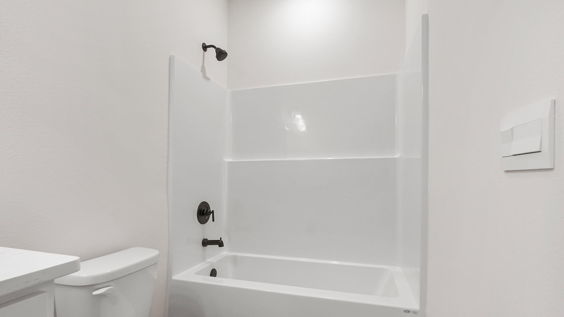 The bath in bedroom four has a shower tub combination.