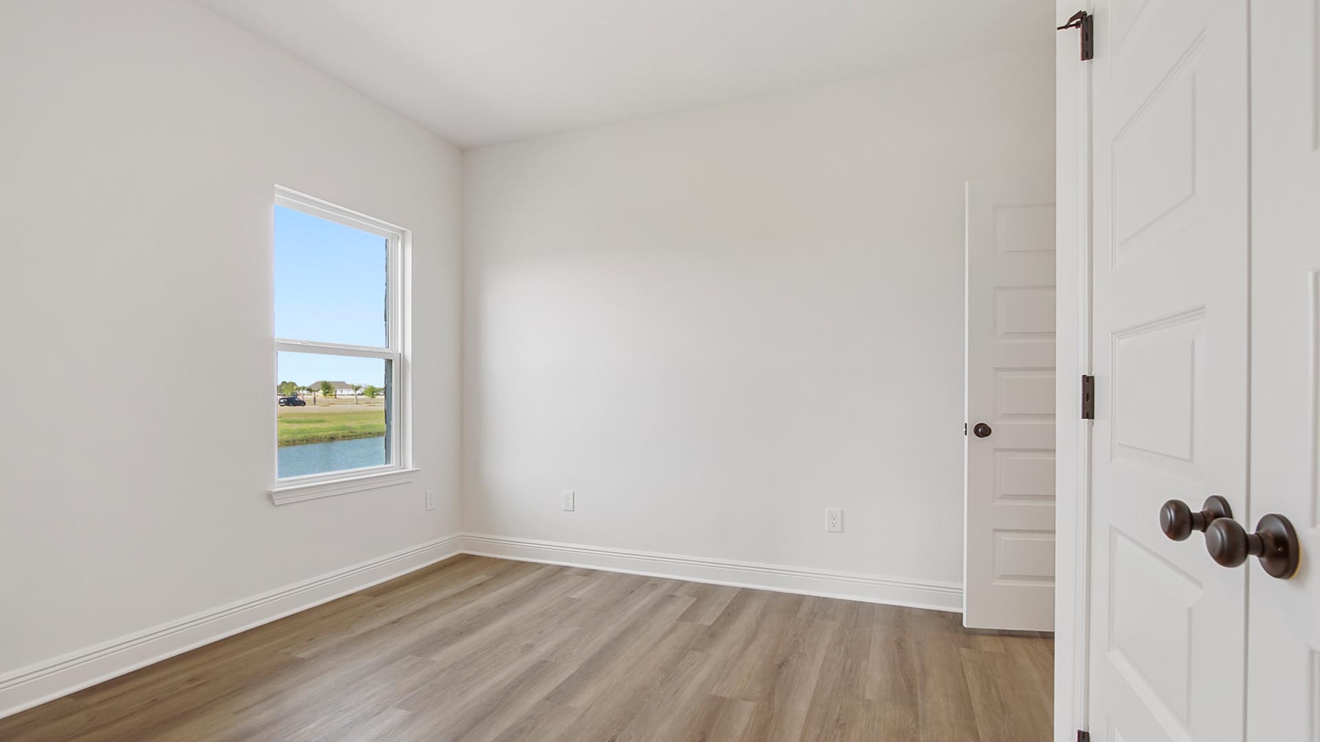 Bedroom three has EVP flooring and ample closet space