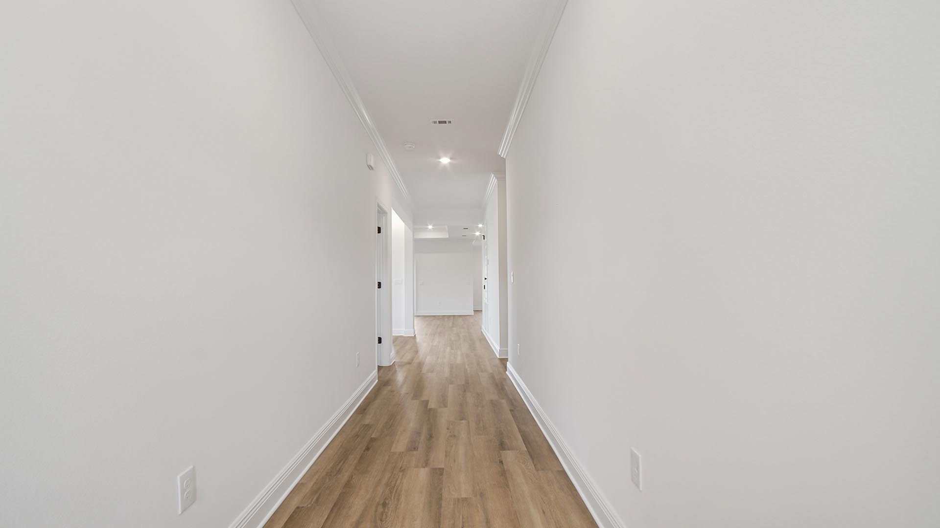 The entry to the this home has EVP flooring leading to the open concept living area