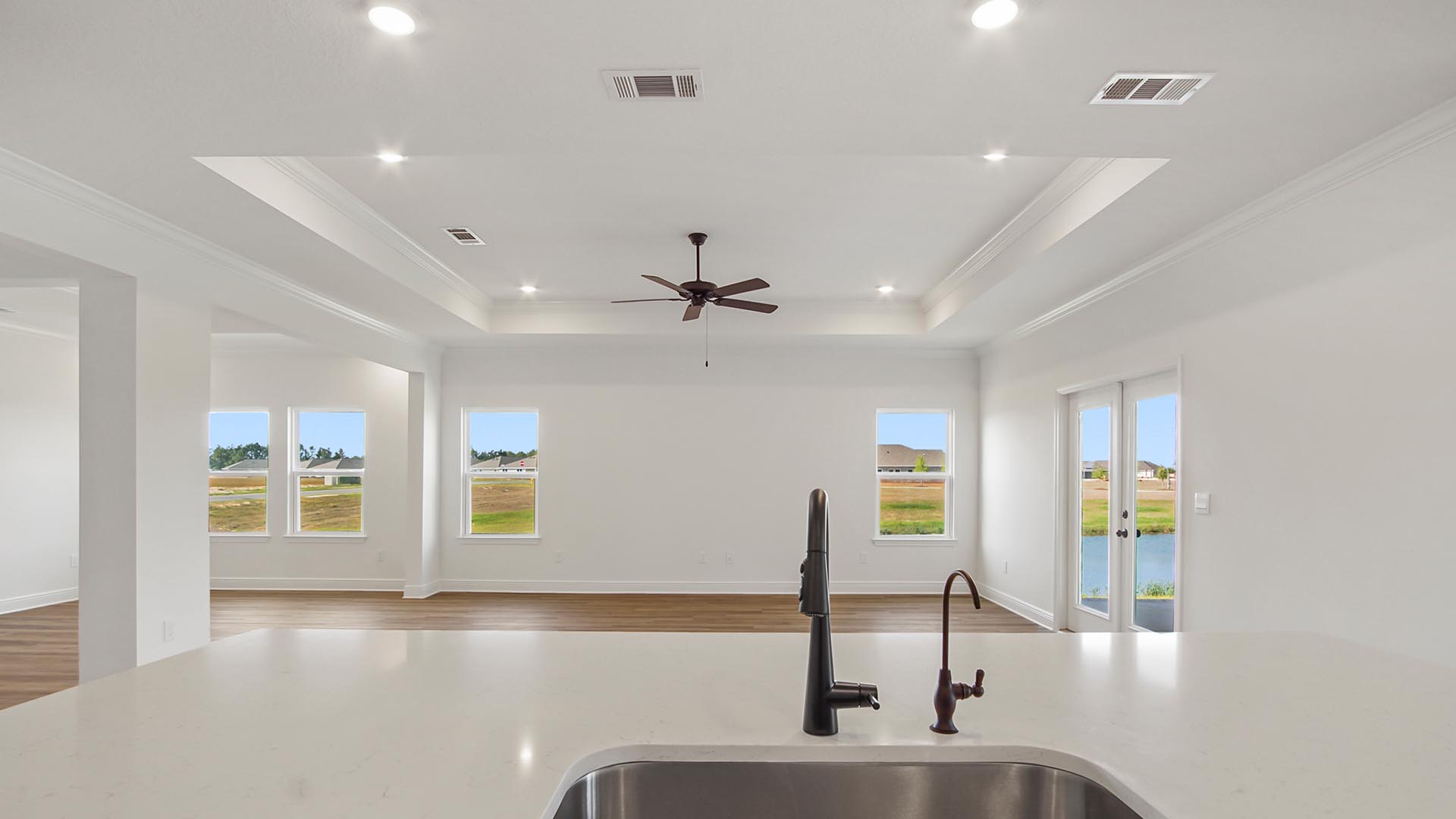 The center island has the dishwasher and stainless sink