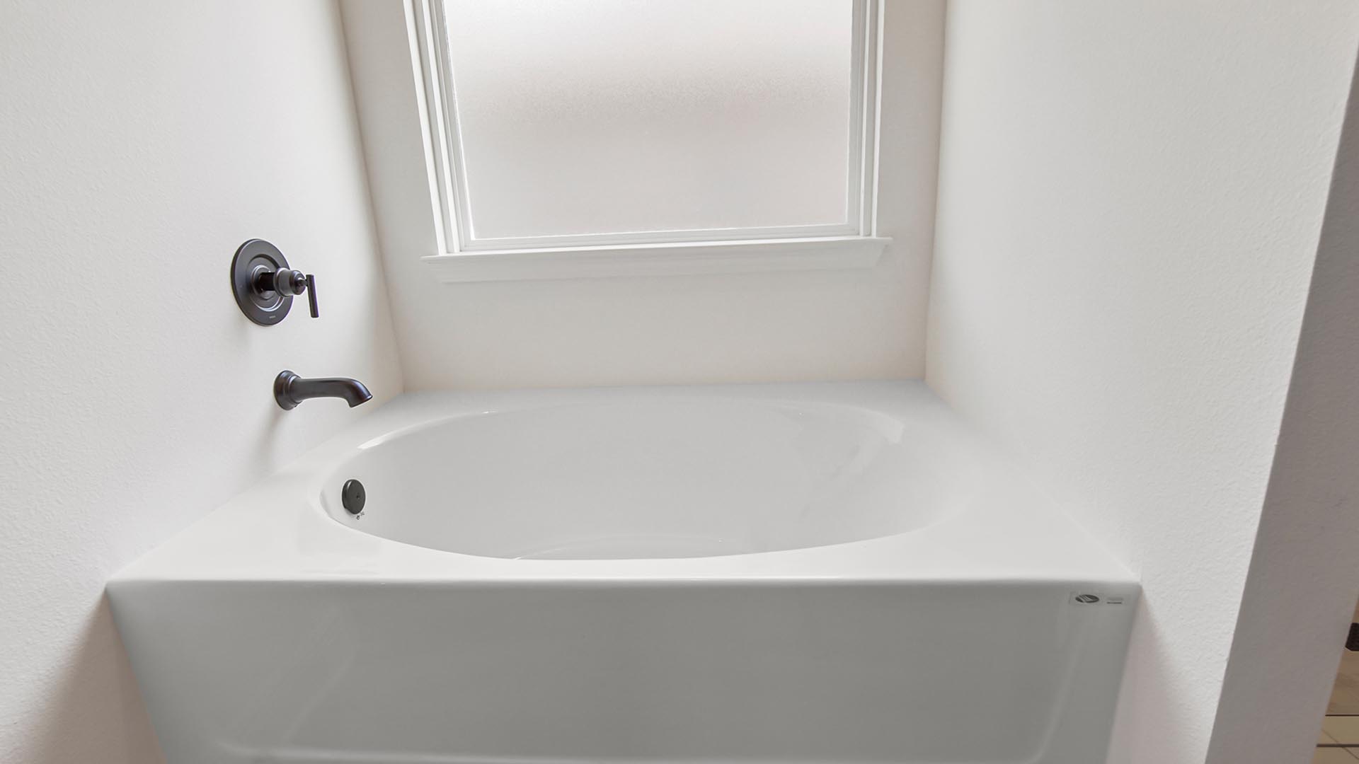 There is a large soak tub in the primary bathroom