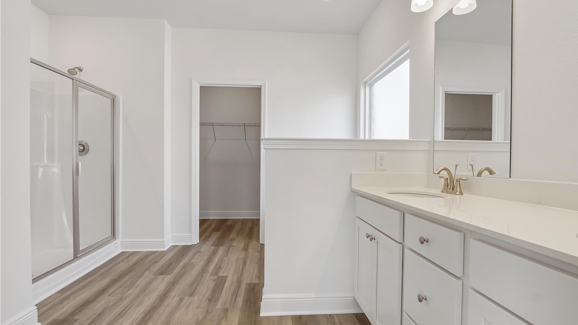 The primary bathroom offers a luxurious retreat