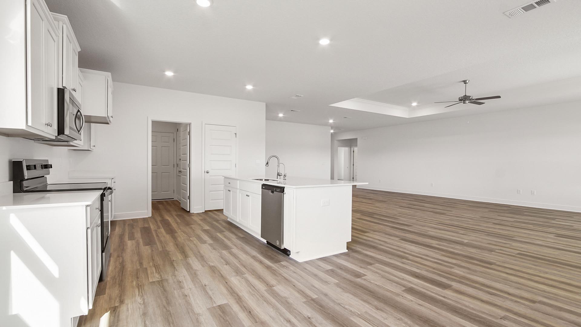 The kitchen is the focal point and is adorned with elegant features