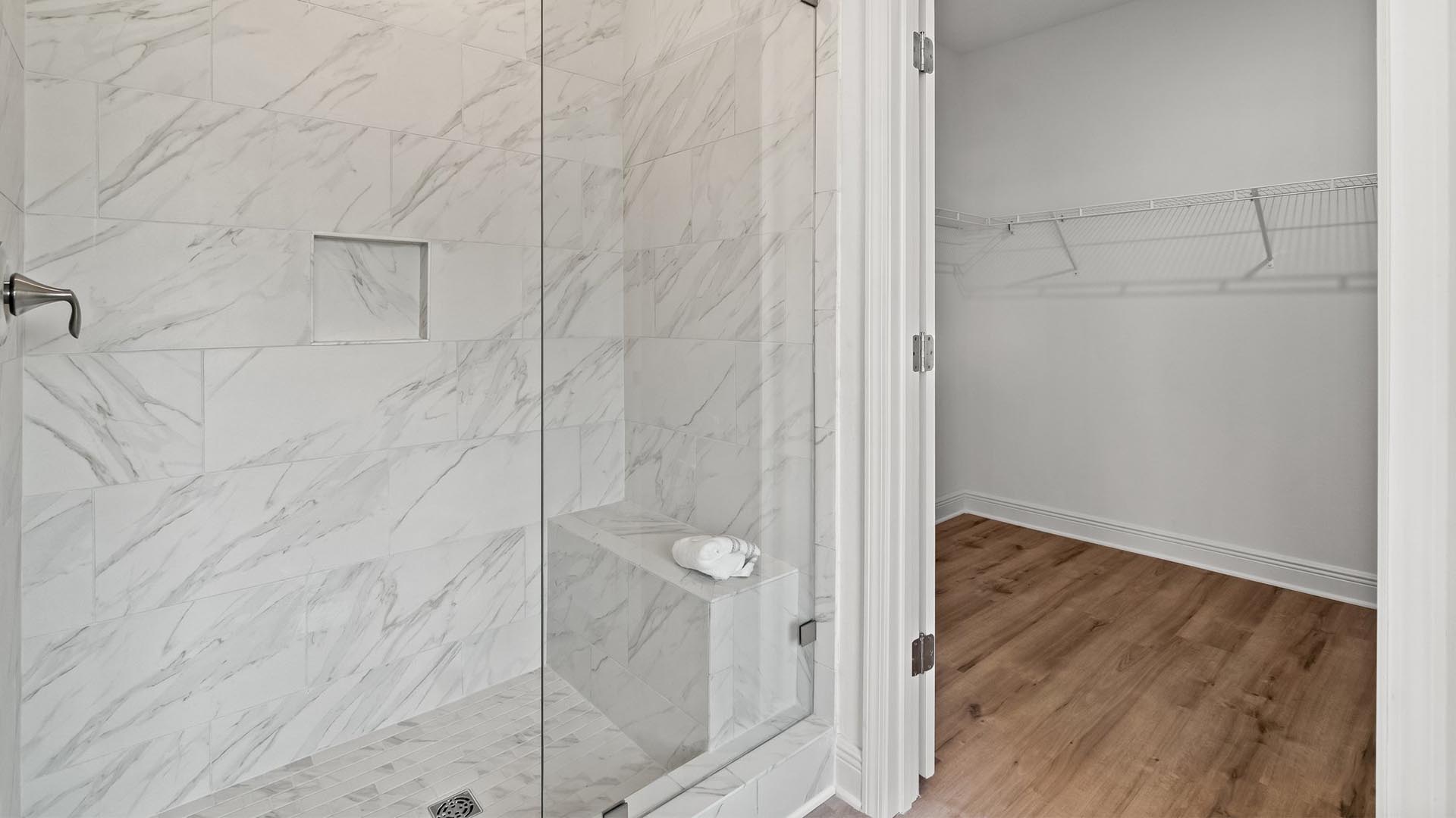 A spacious closet is located in the primary bathroom