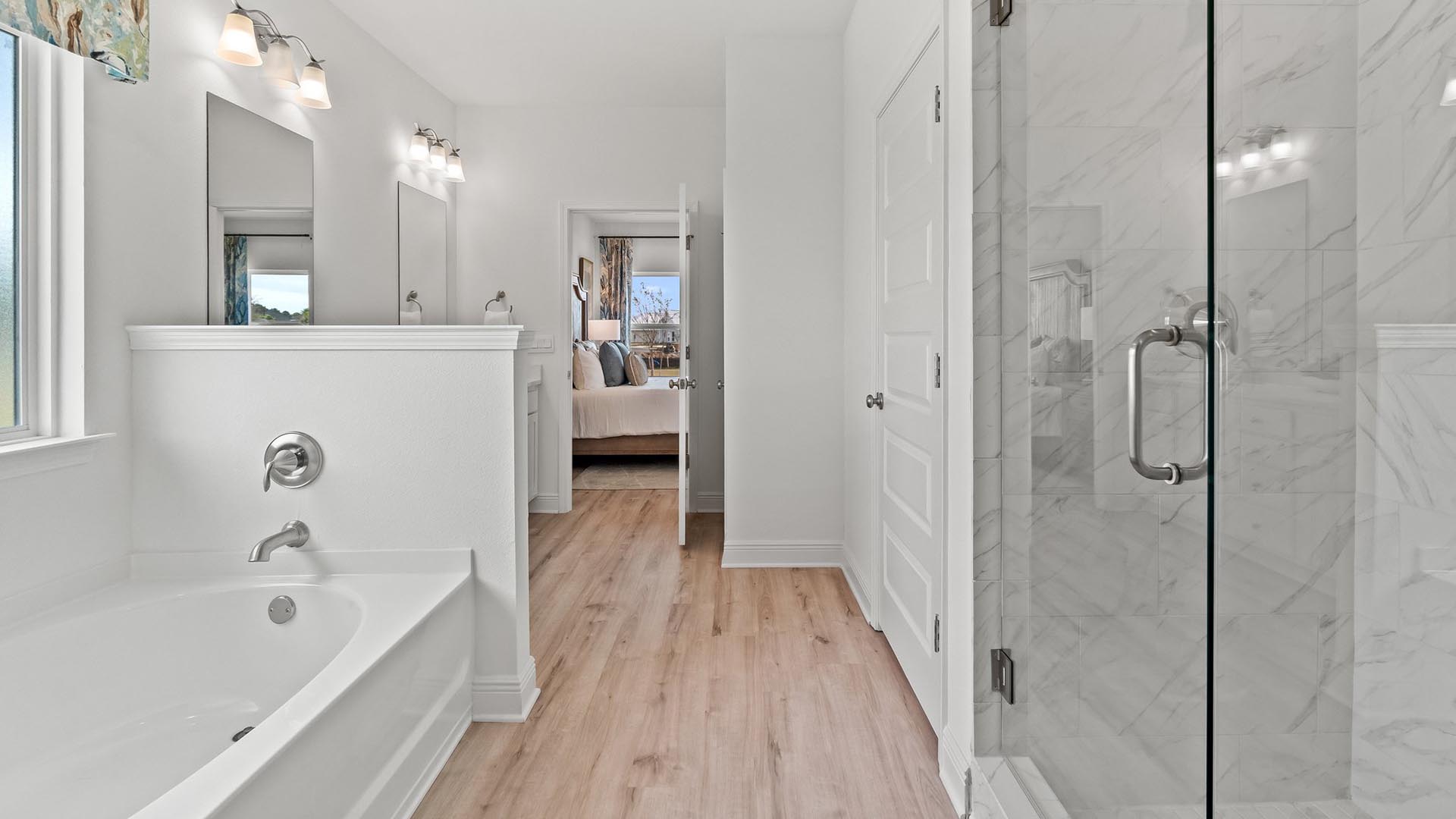 The primary bathroom features a separate shower and large soak time