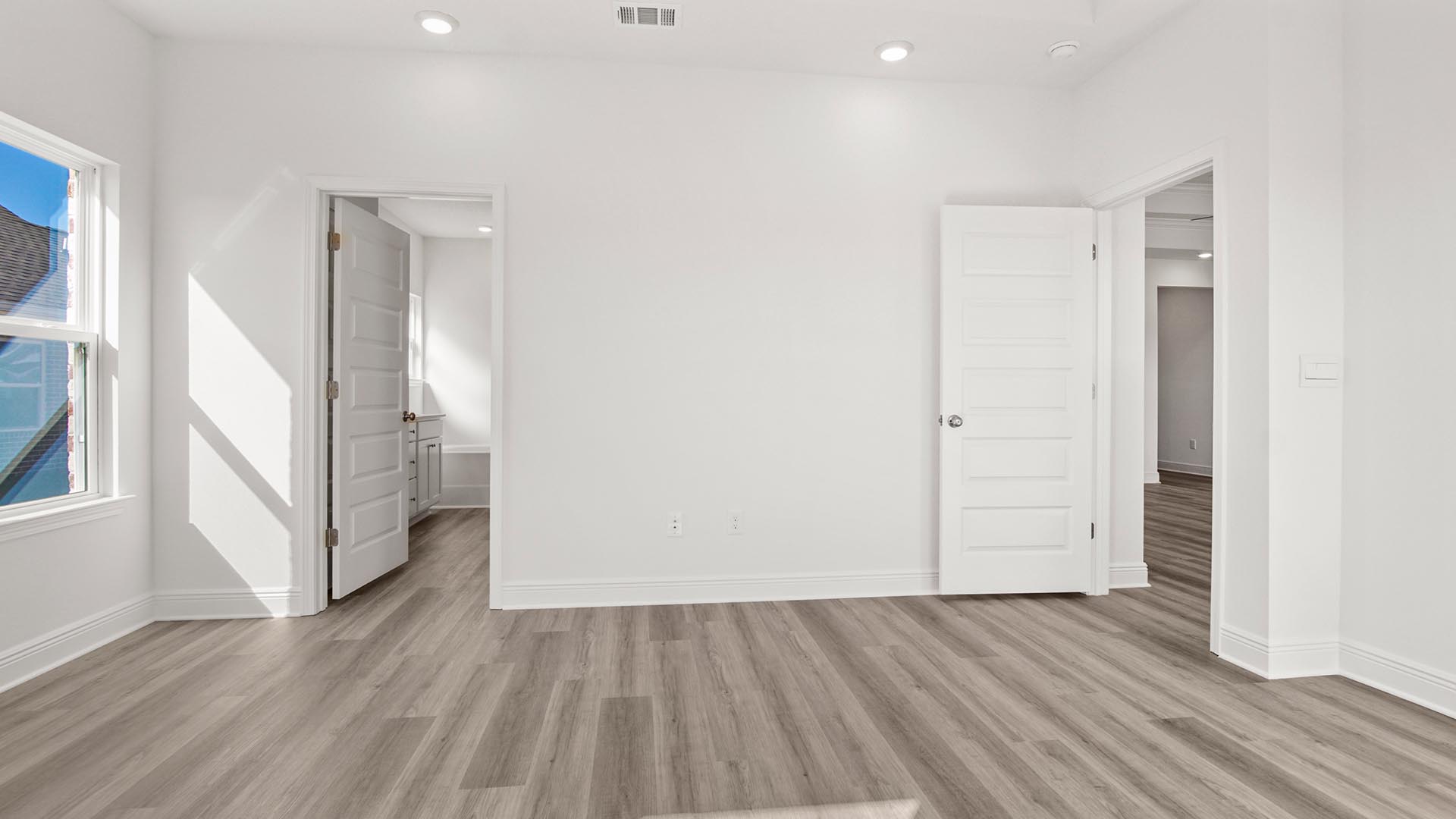 An elegant ensuite is in the primary bedroom