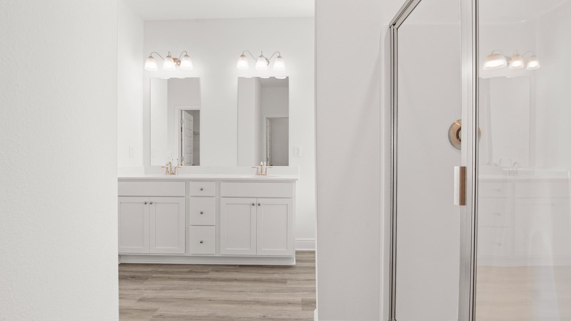 The vanity has lower cabinetry for storage