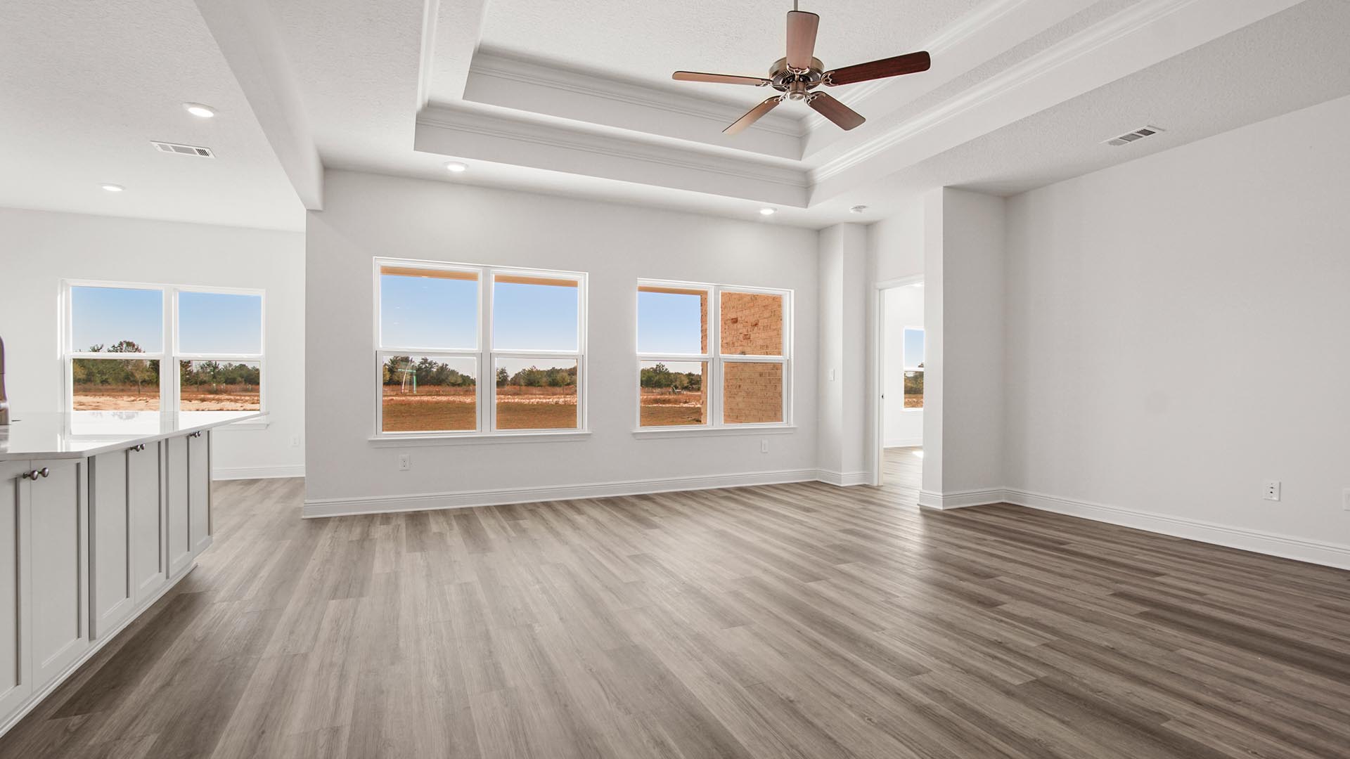 The open concept living area offers a functional space for entertaining family and guests