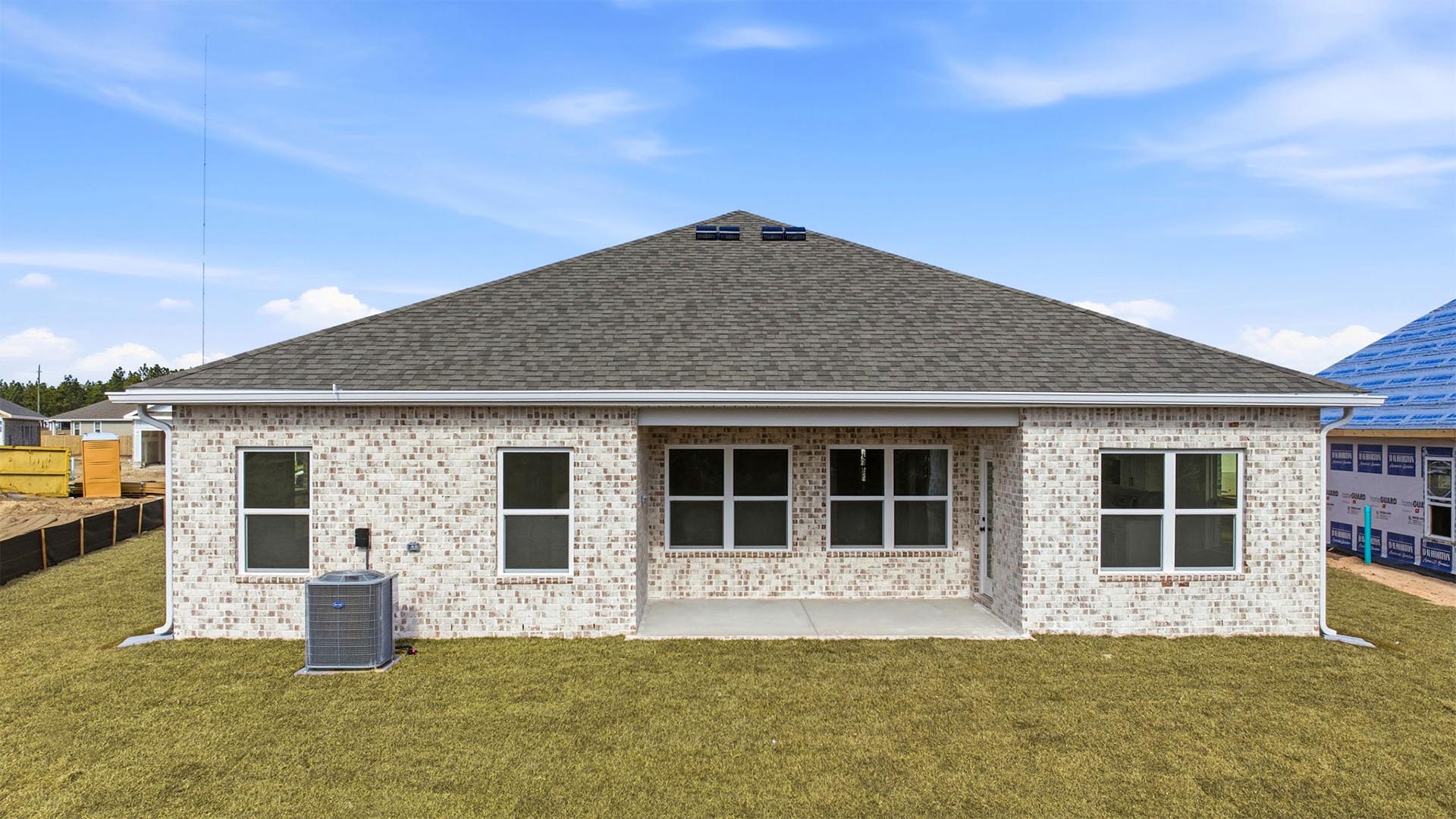 There is a covered patio at the back of the home and full brick rear