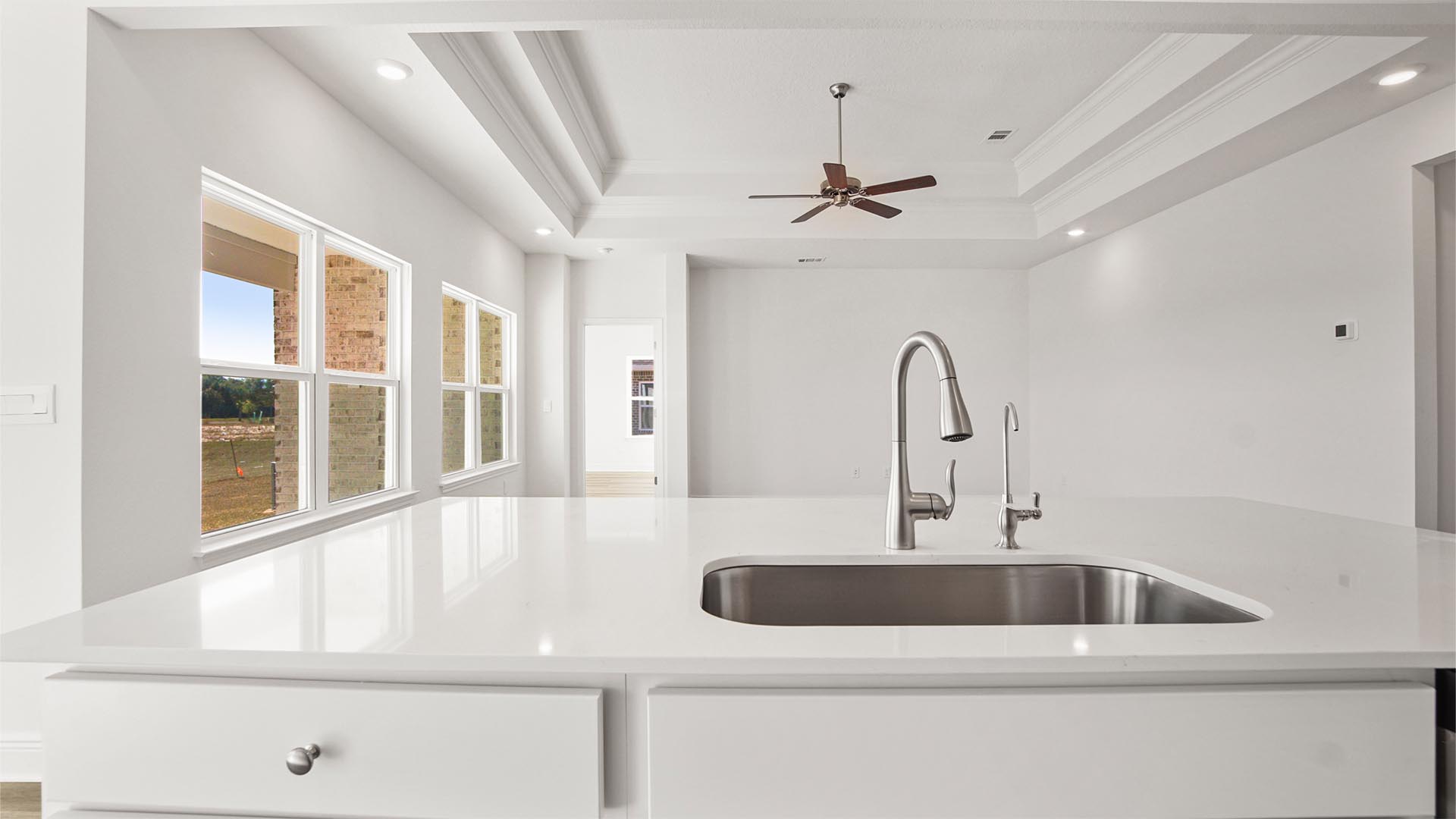Quartz countertop and center island with lower cabinetry