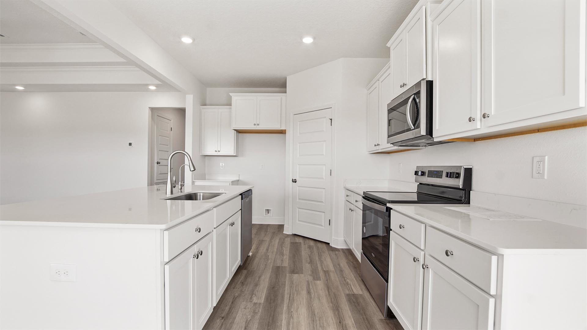 The kitchen features a large pantry for storage