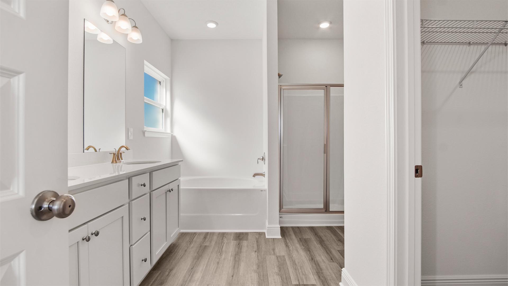 Large primary bathroom offers a spa like retreat