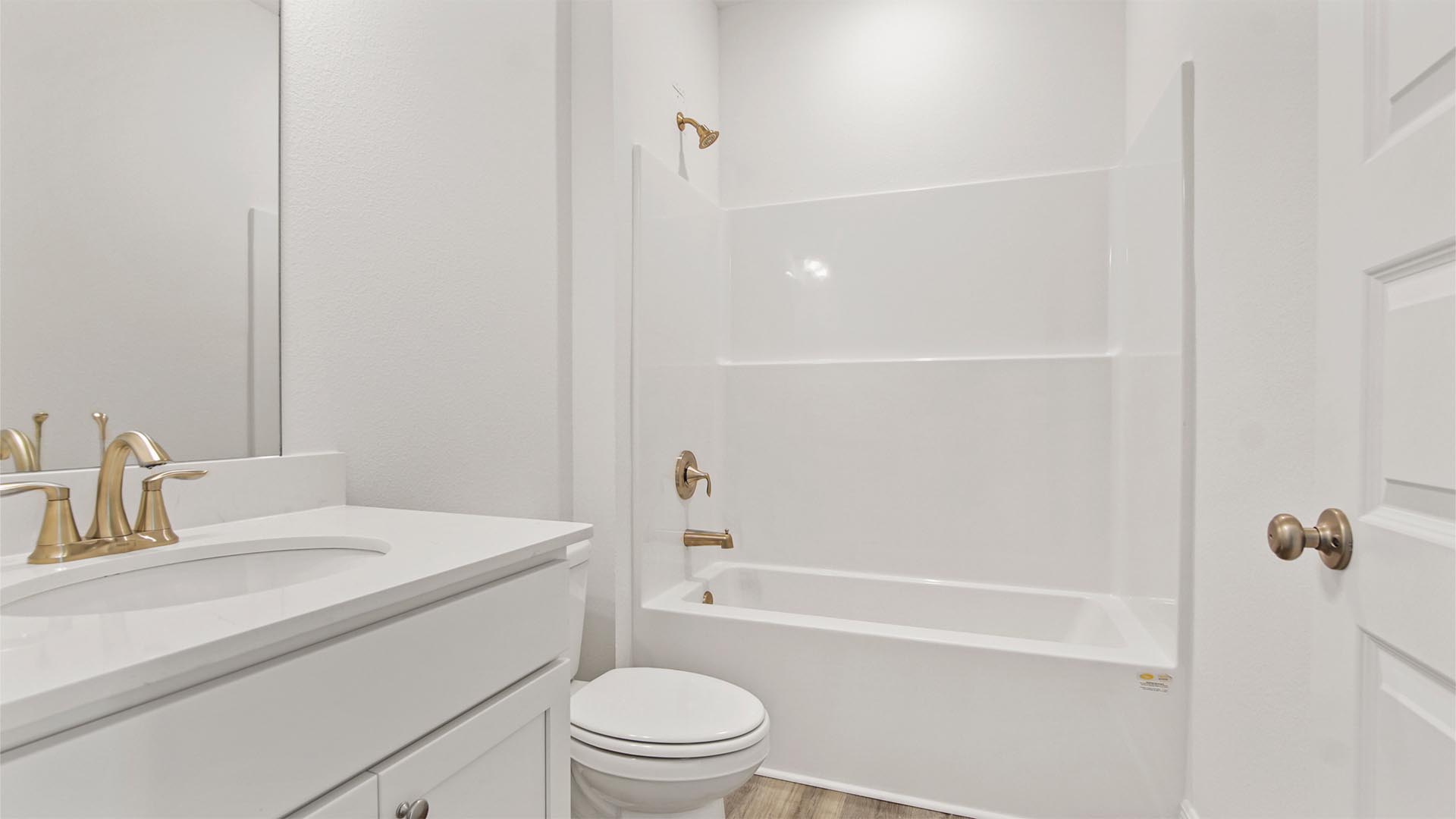 The shared bathroom features a single vanity, quartz countertops and shower tub combination