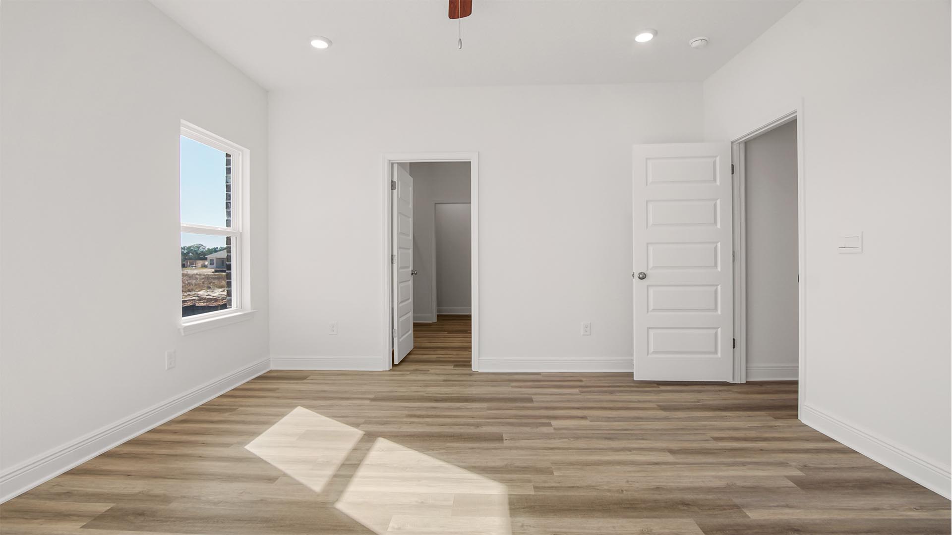 The primary bedroom has EVP flooring and features a private ensuite