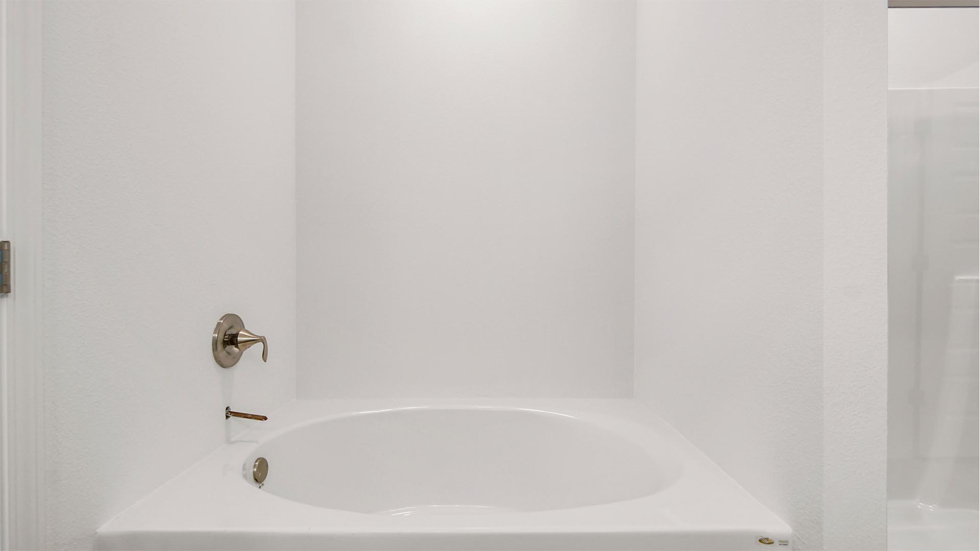 Primary bathroom has a large soak tub for a relaxing retreat