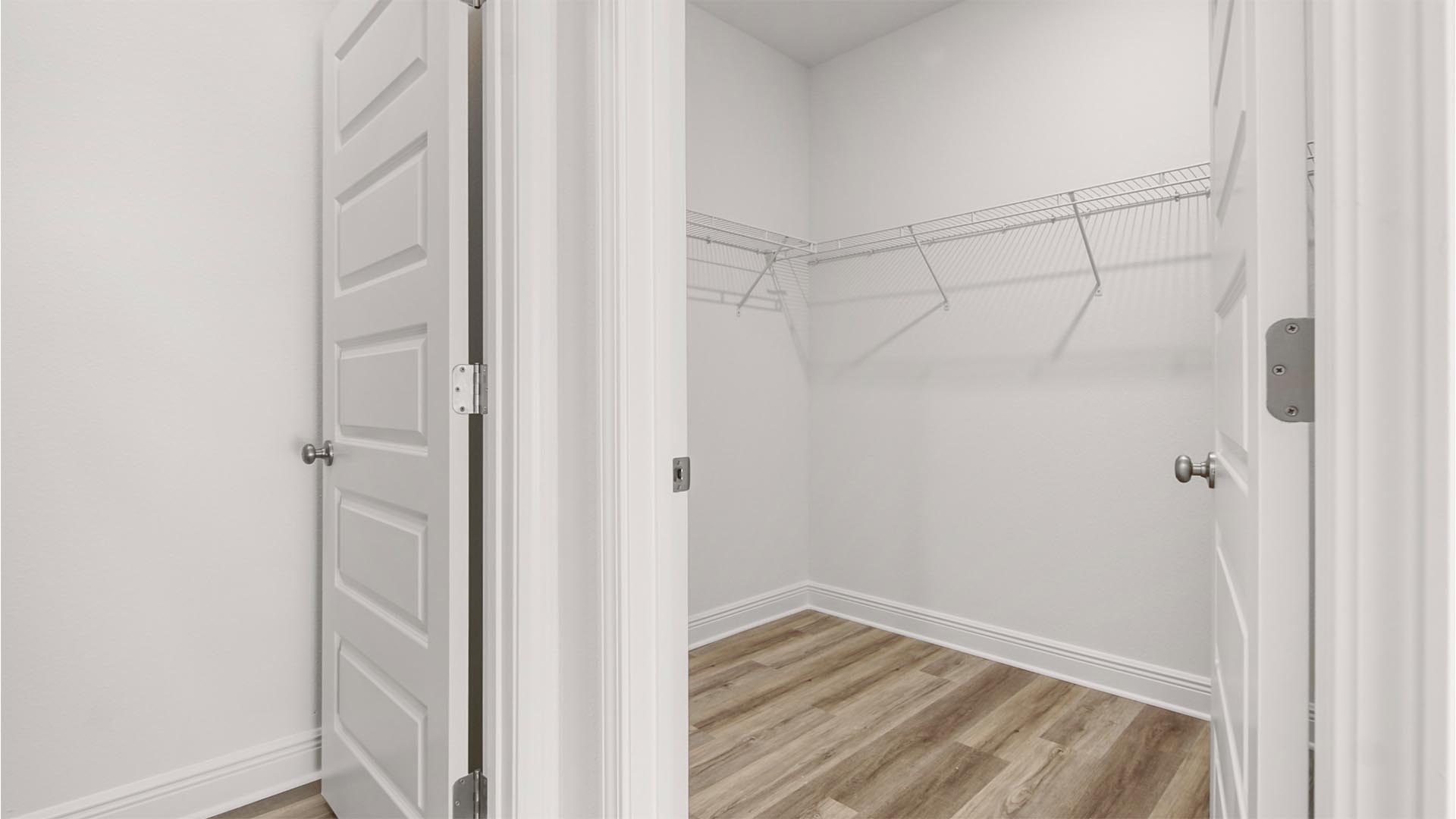 A spacious closet is located in the primary bathroom
