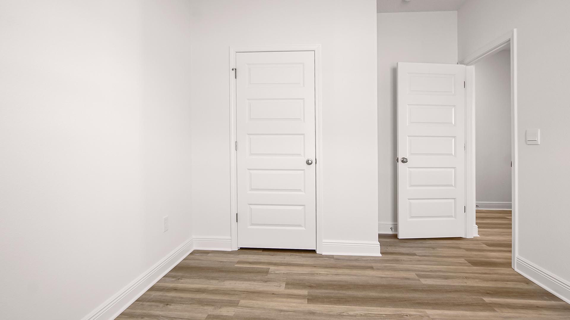 Two of the additional bedrooms are located off the foyer