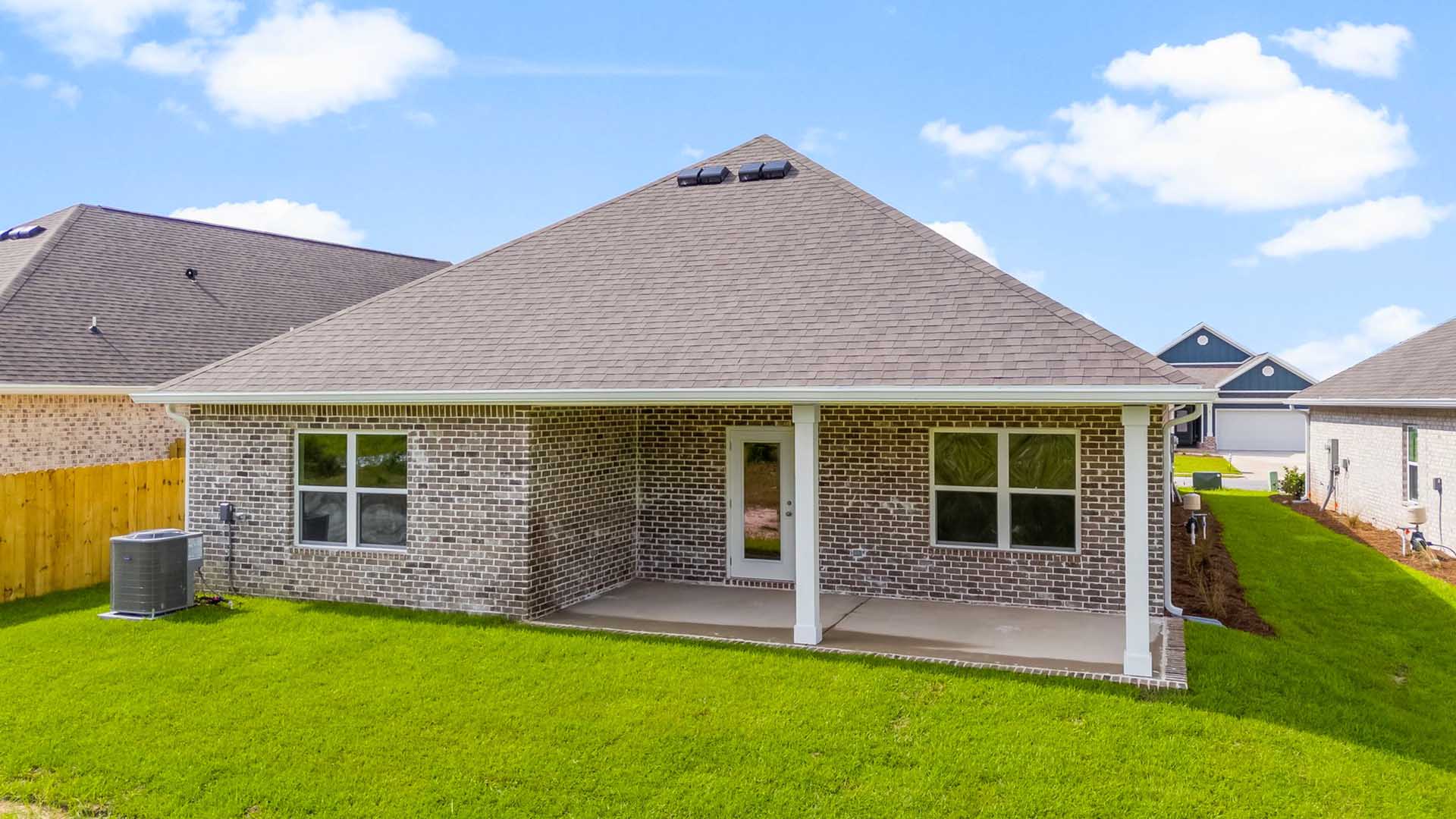 There is a covered patio at the back of the home