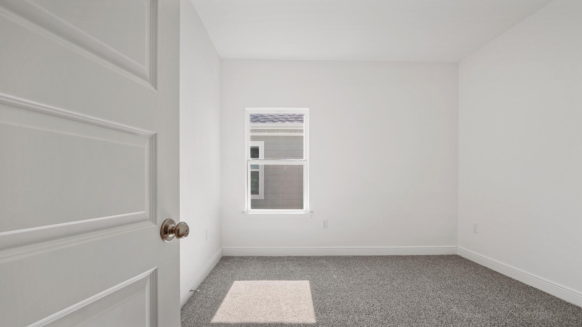 Bedroom four is spacious and features carpet