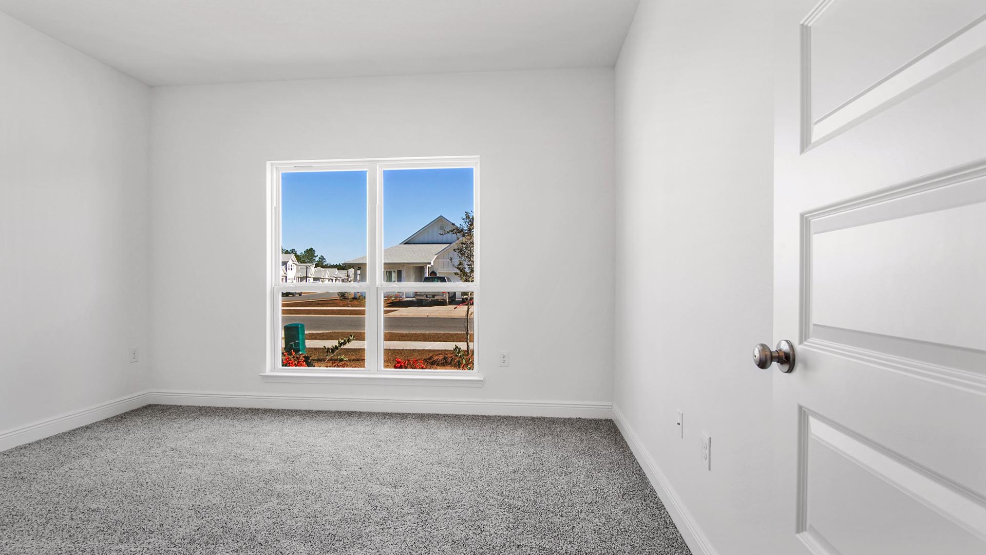 Bedroom two has a large picture window