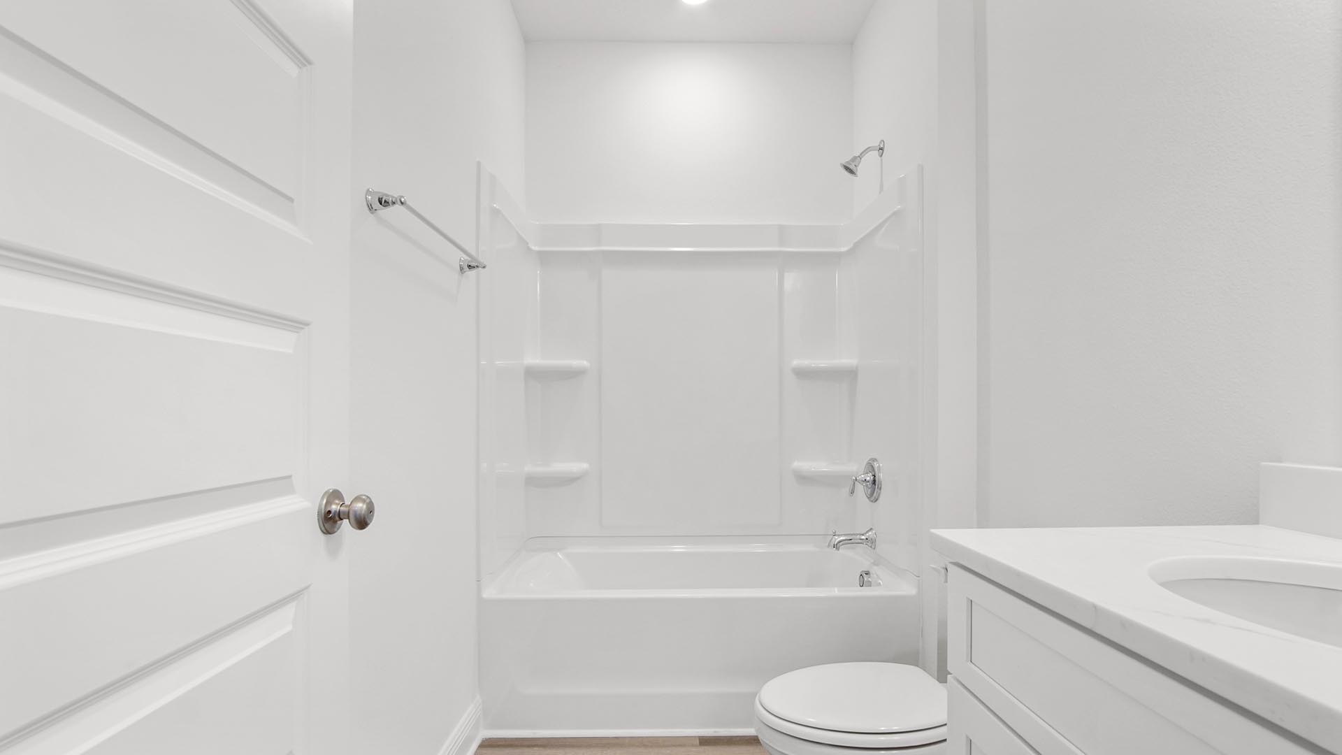 The shared bathroom has a shower tub combination