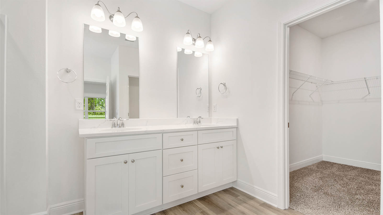 The primary bathroom has a dual sink vanity