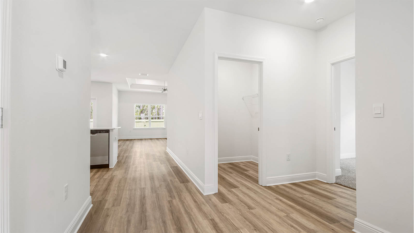 Hall leading to additional bedrooms