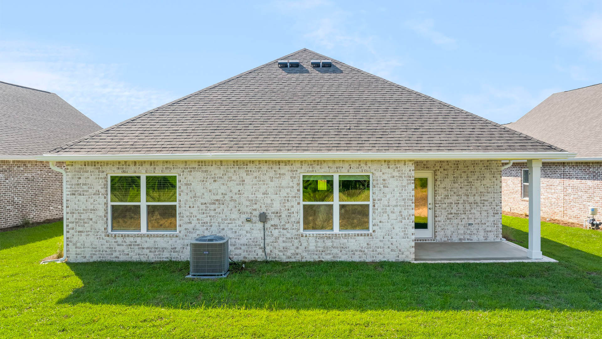 The Rhett features a covered patio with space for seating or dining area