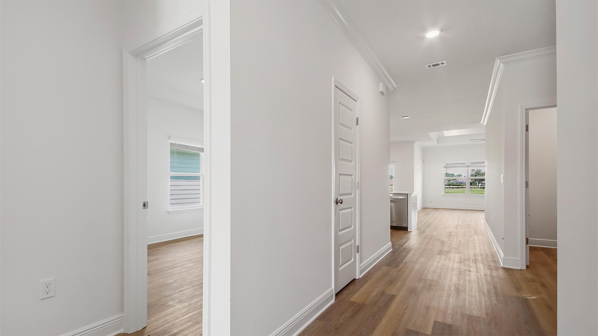 Two guest bedrooms are just off the front entry hall