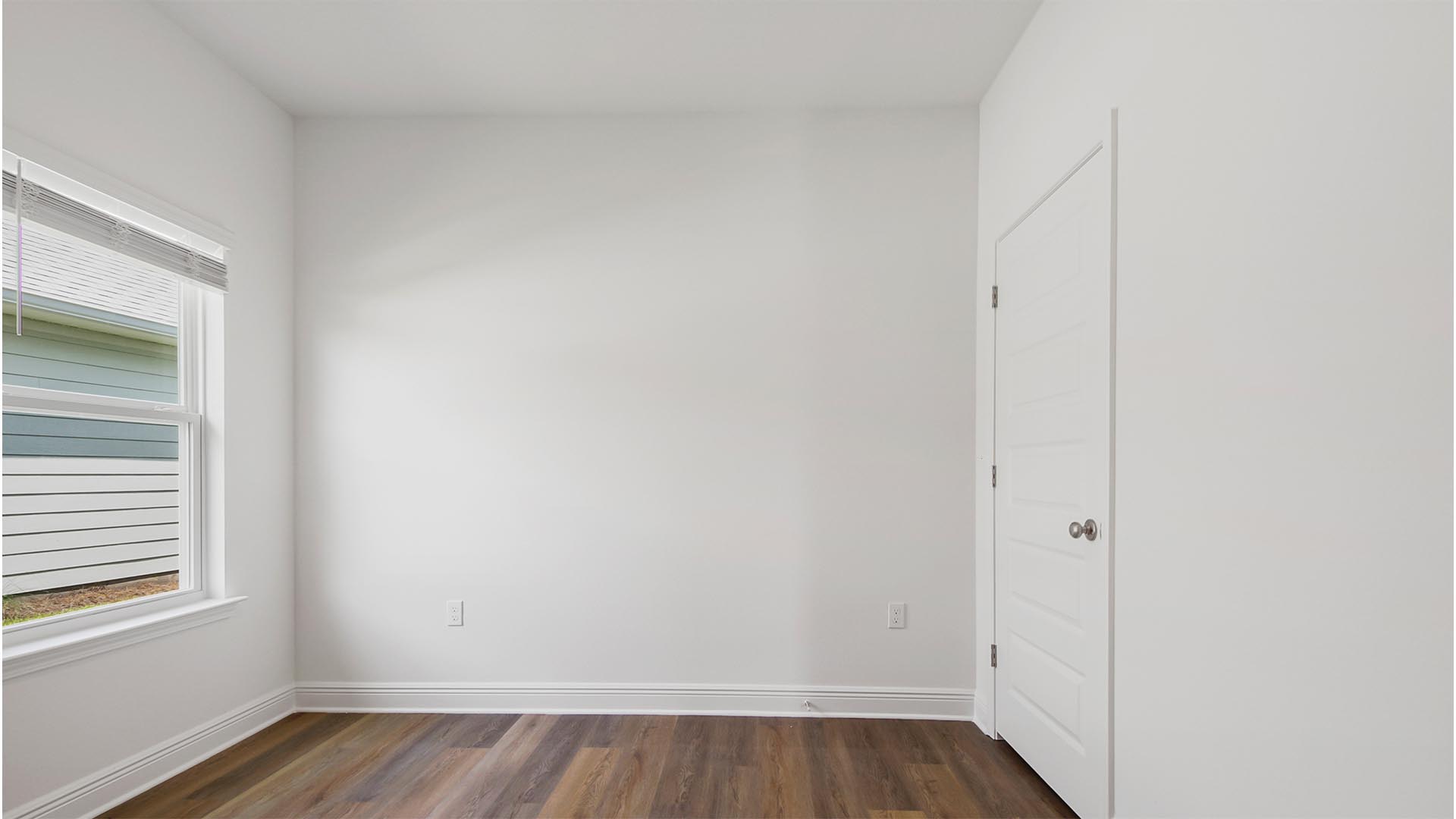 Bedroom three has EVP flooring