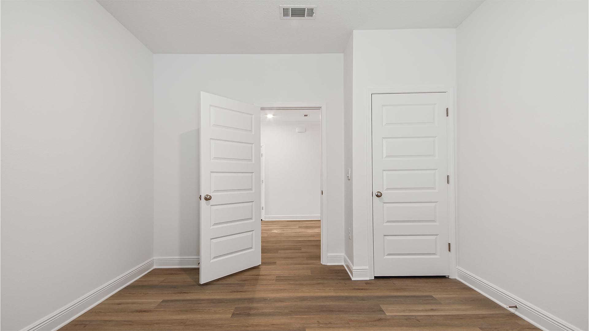 There is a second hall leading to bedroom four the garage and laundry room