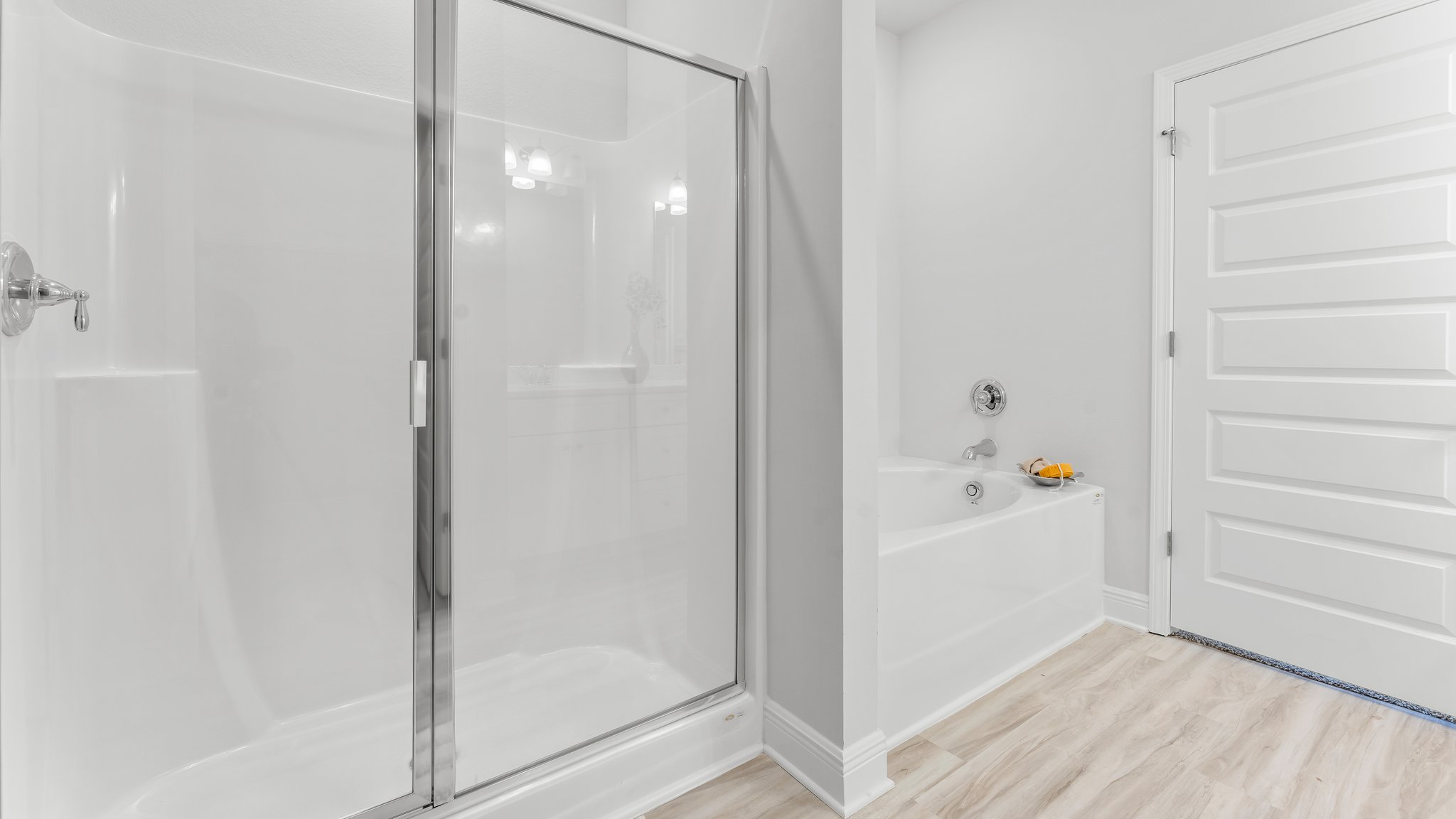 The primary bathroom has a shower and tub combination