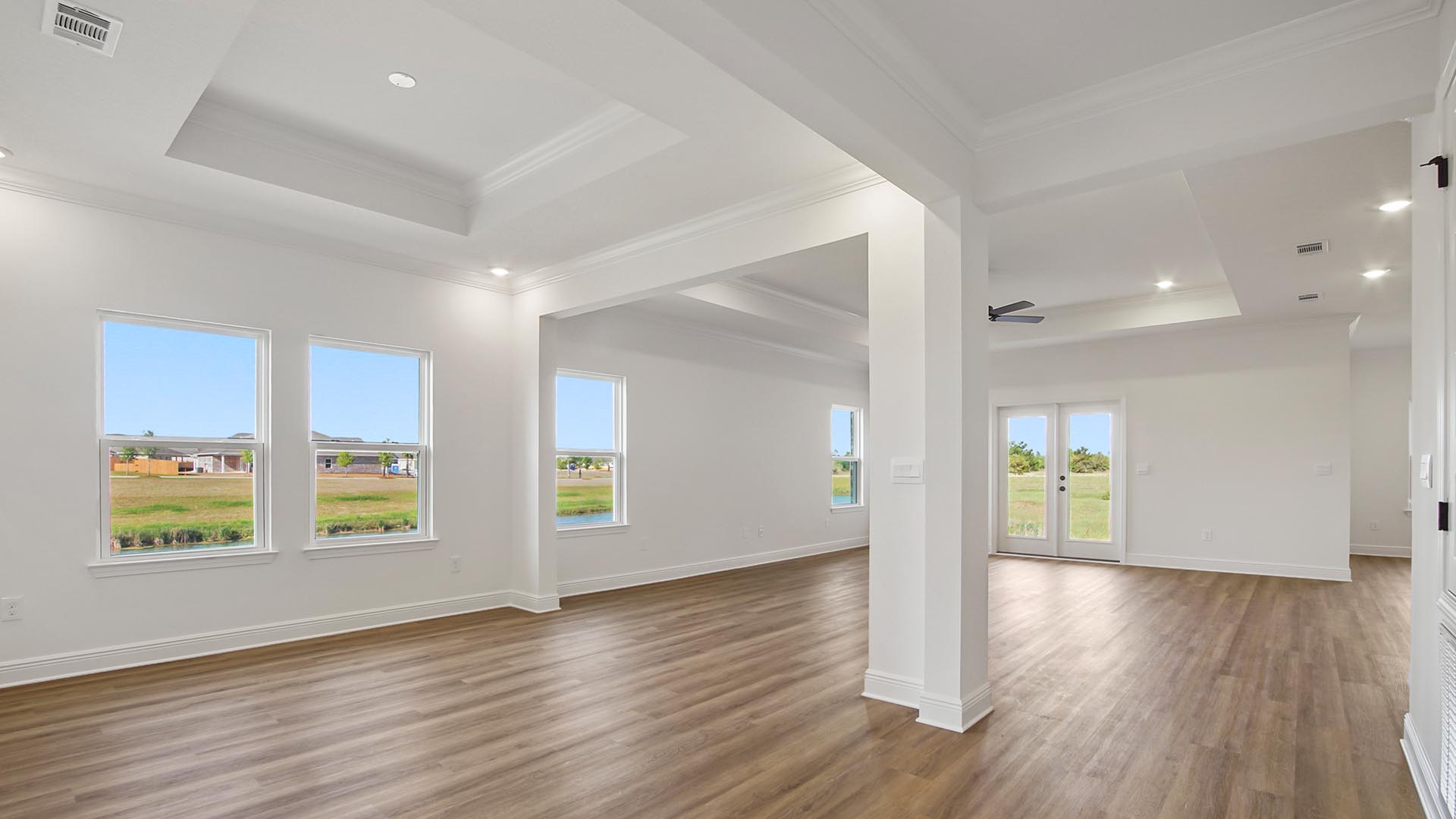 The open concept living area features a formal dining area, a spacious living room and kitchen