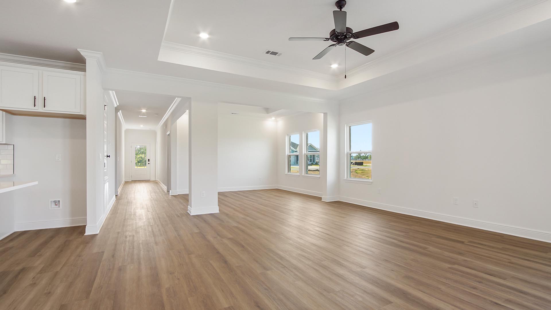 The living area is seamlessly connected with EVP flooring