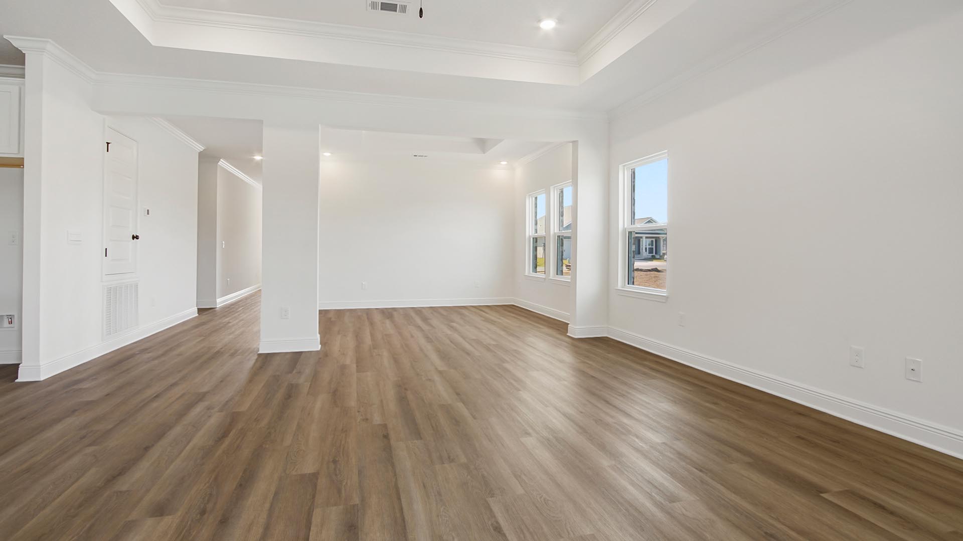 The living area is well illuminated with windows