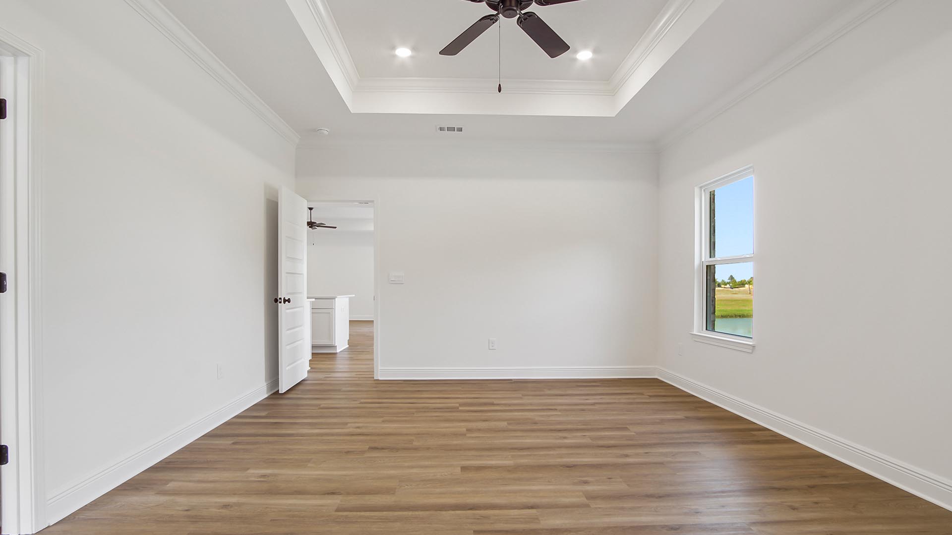 The primary bedroom has an elegant ensuite bathroom