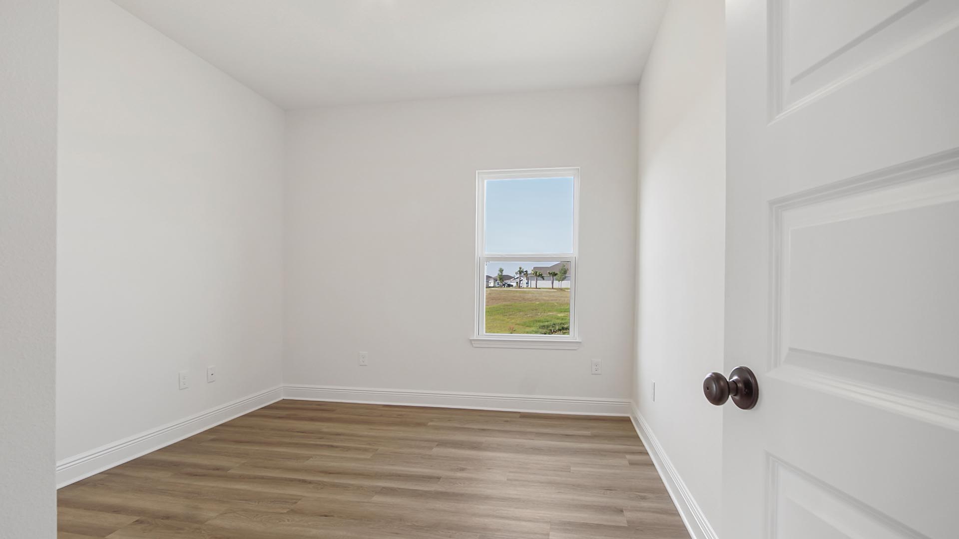 Bedroom three is located off the front entry hall