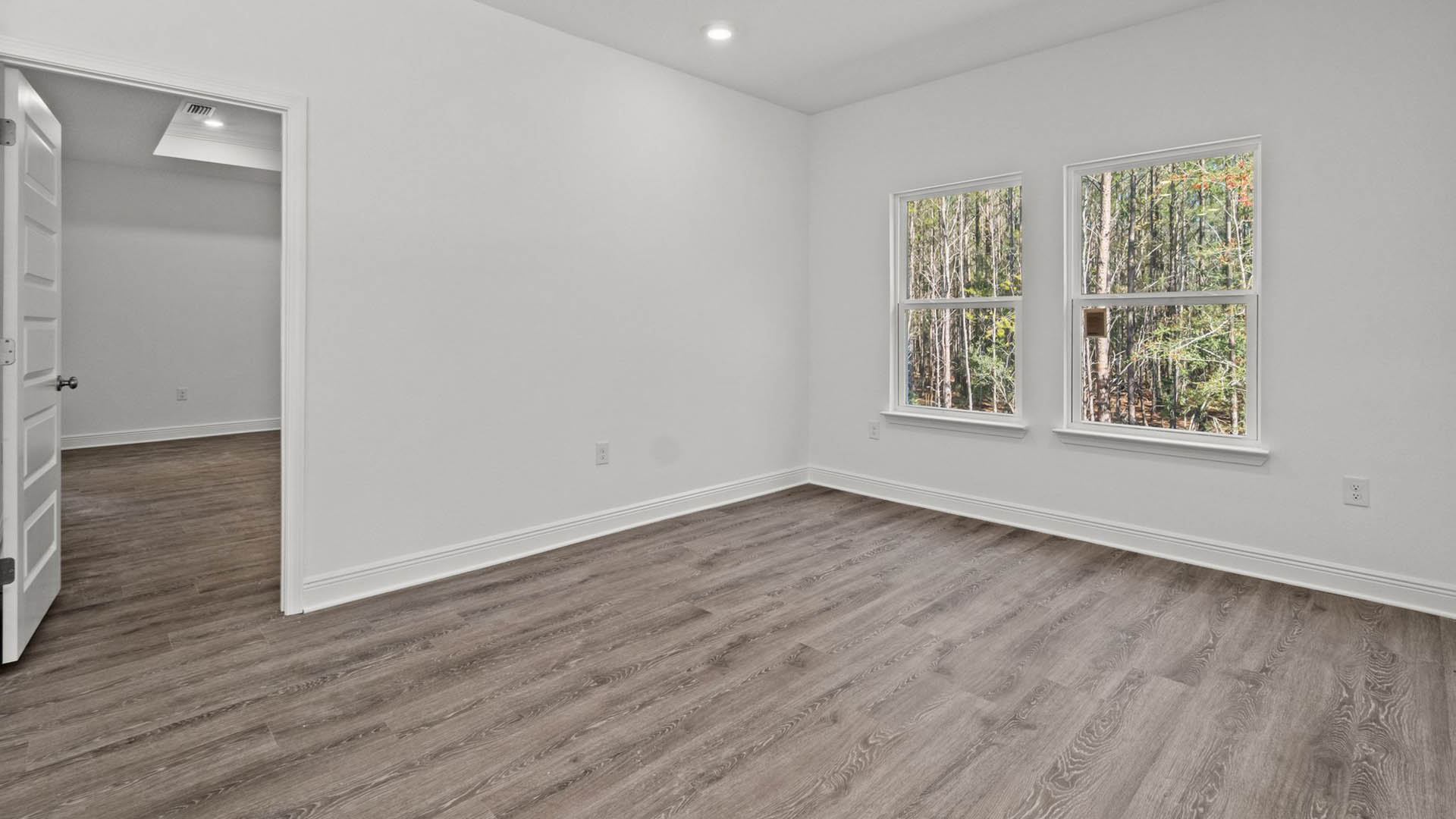 Open breakfast room with expansive windows allowing for natural light