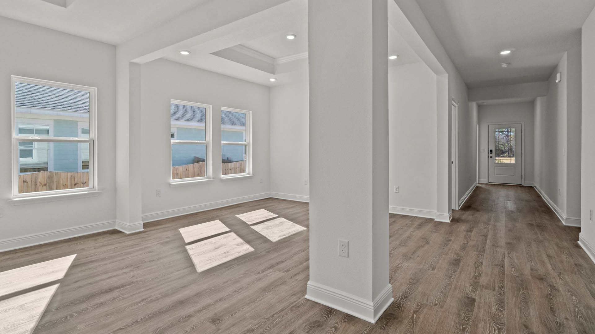 Living room leading to the appointed dining area with EVP flooring