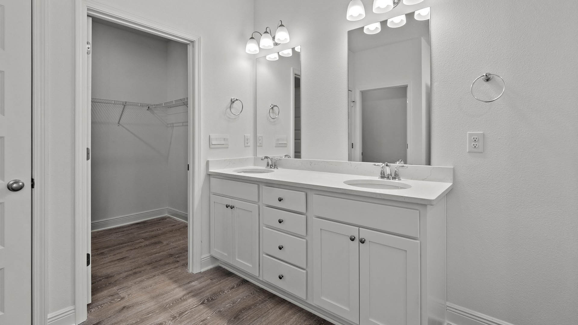 The primary bathroom features EVP flooring and a large closet