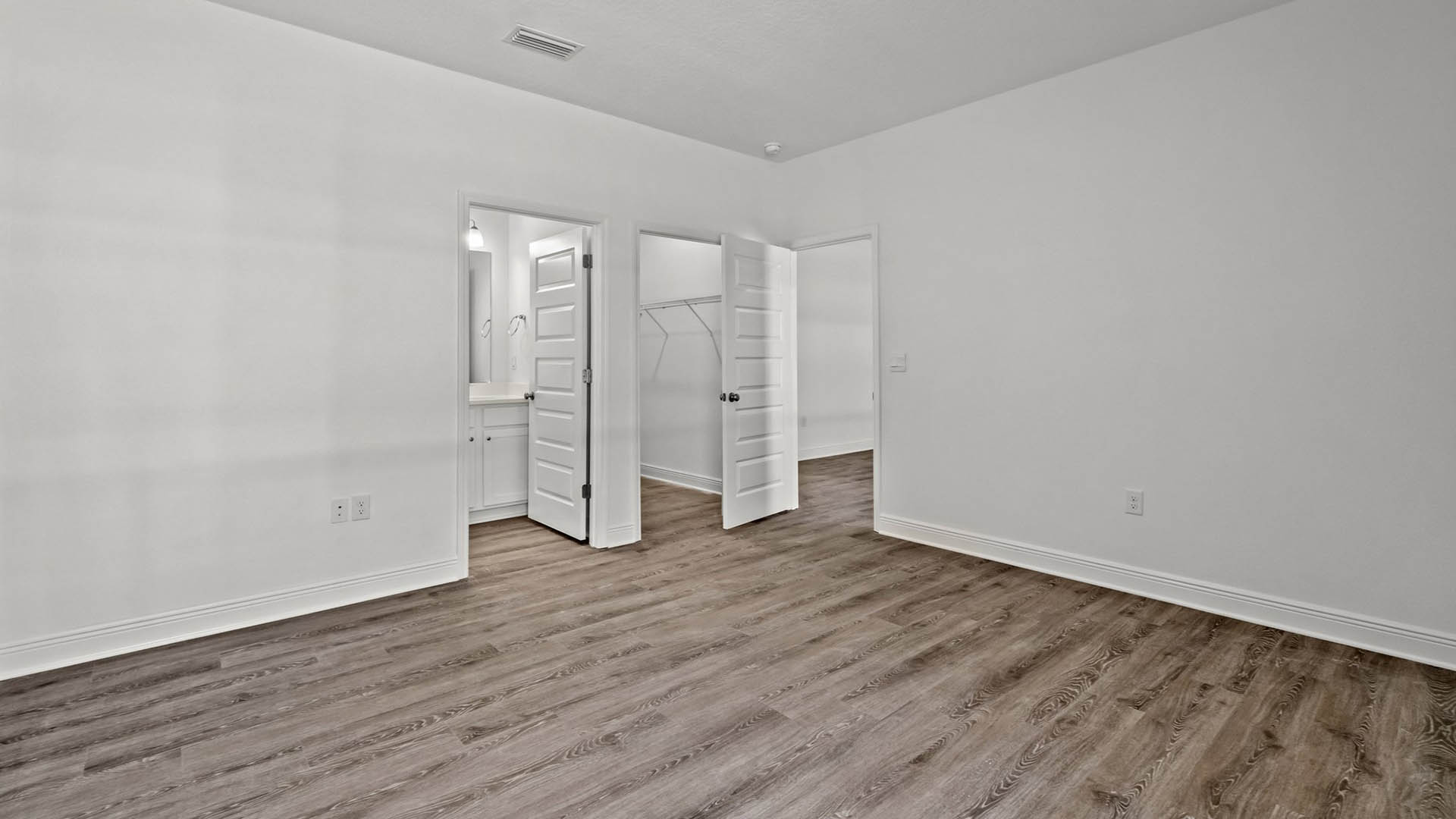 Bedroom four has its own private ensuite bathroom with shower tub combination and single sink vanity