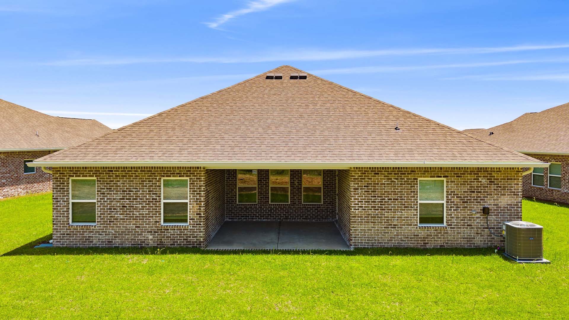 There is a covered patio at the back of the home. The exterior has brick on three sides and Hardie siding with brick skirt on the front.