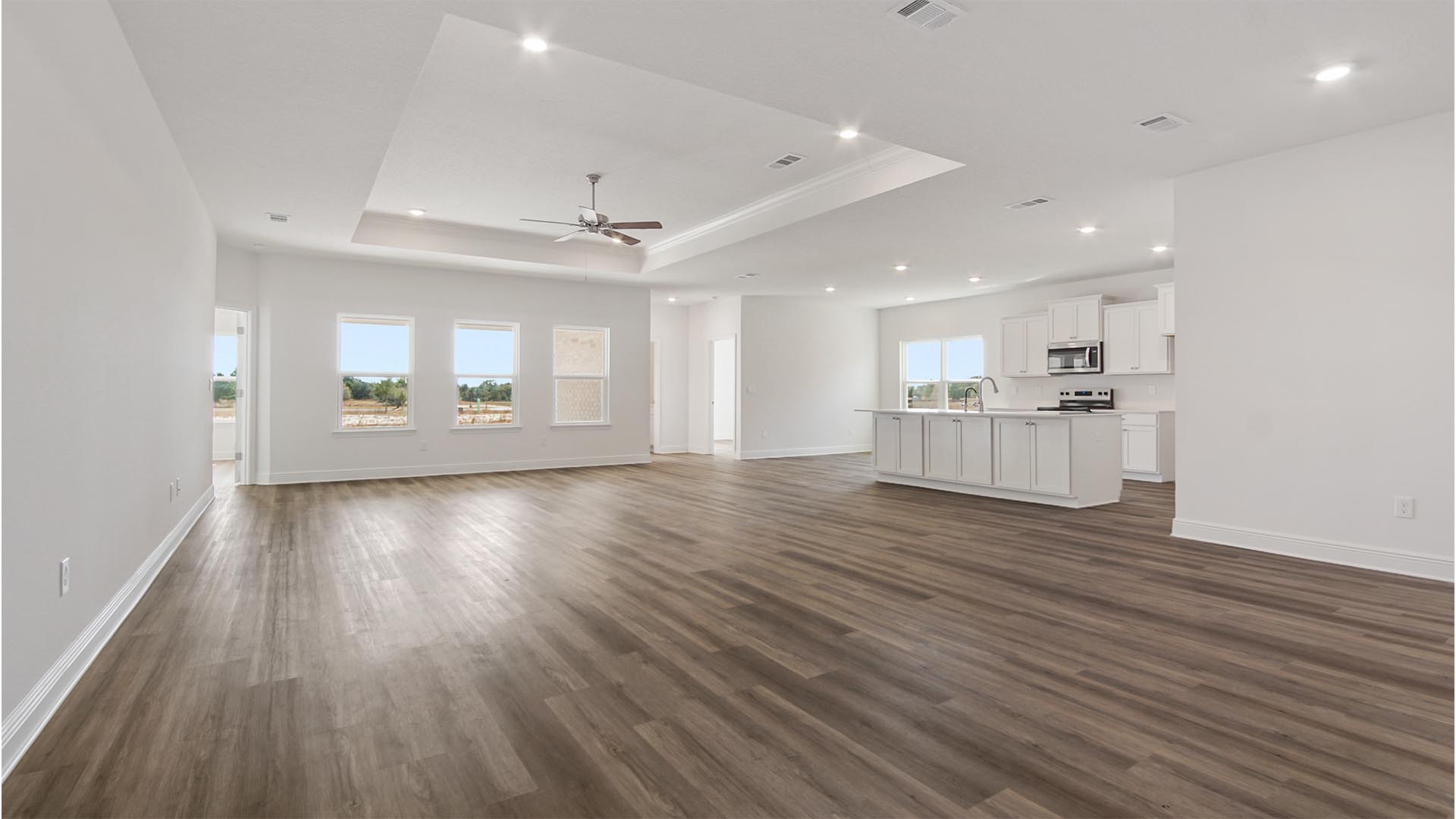 The foyer leads to a grand living space with an open concept design