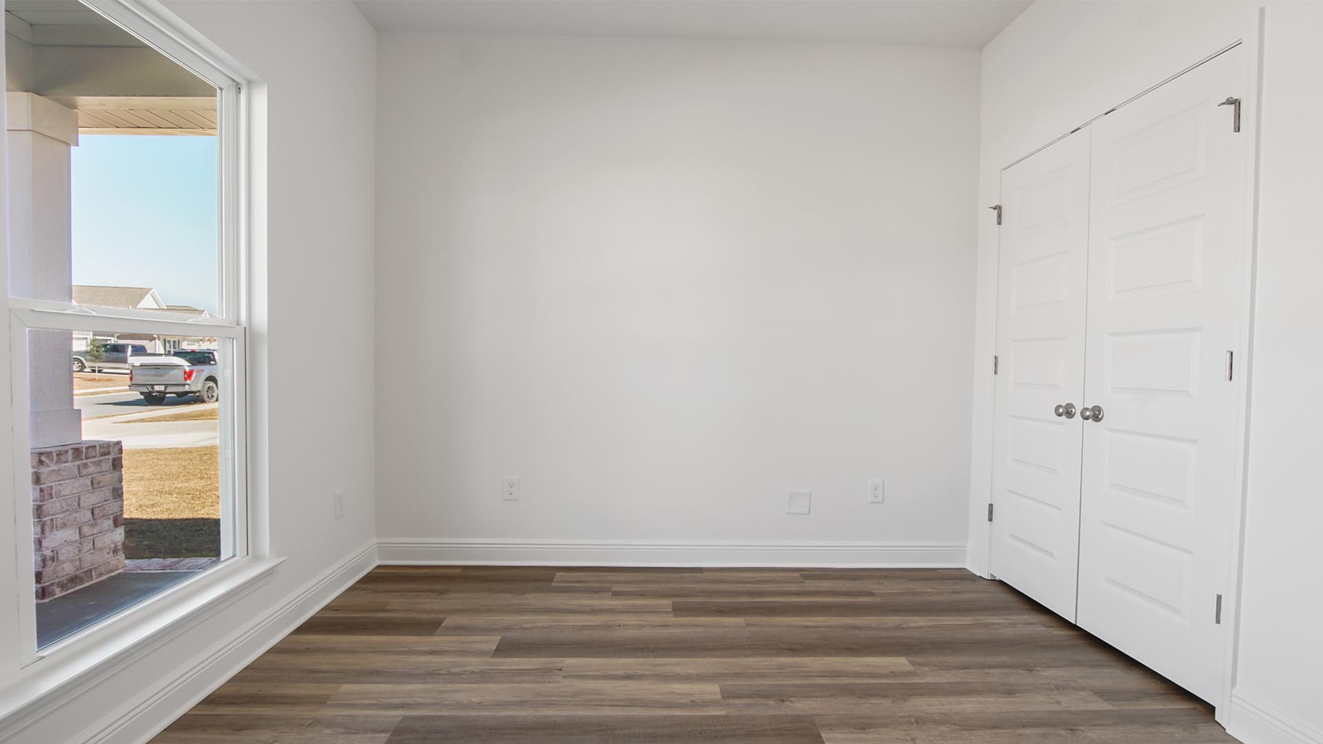 Bedroom three is located at the front of home and could be used as an office space