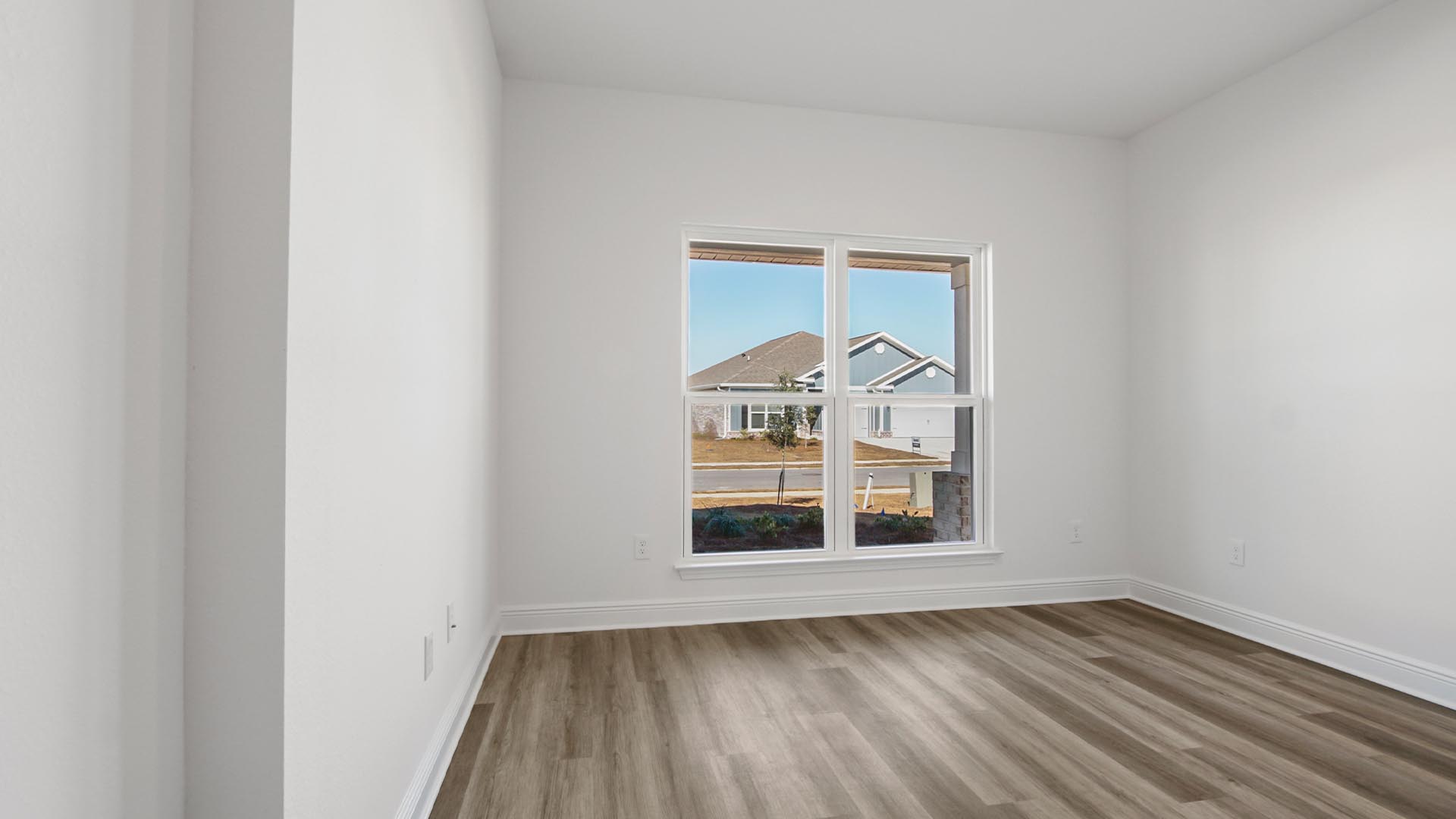 Bedroom three has large windows that allow for natural light